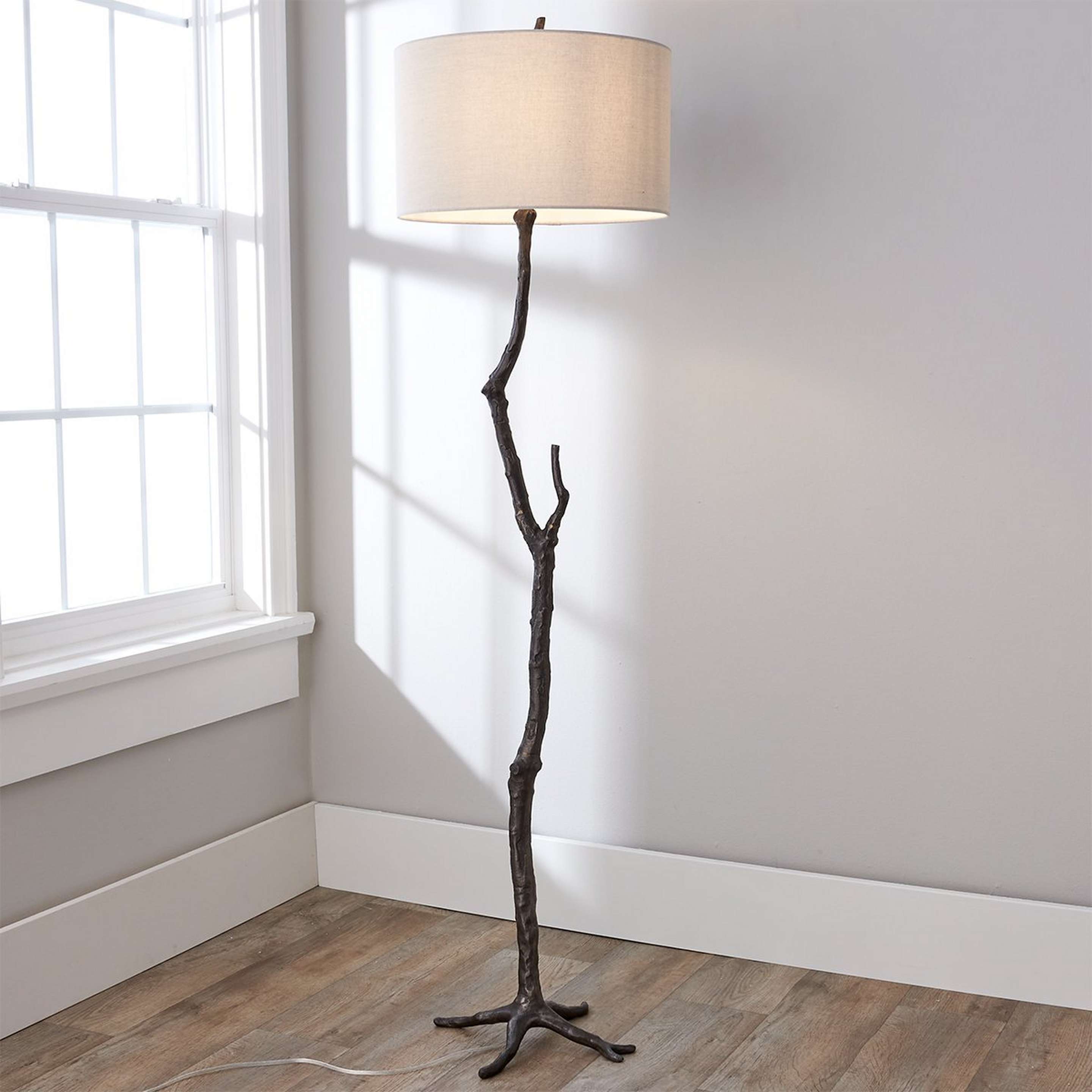 A Ramus Floor Lamp with Cast Iron color