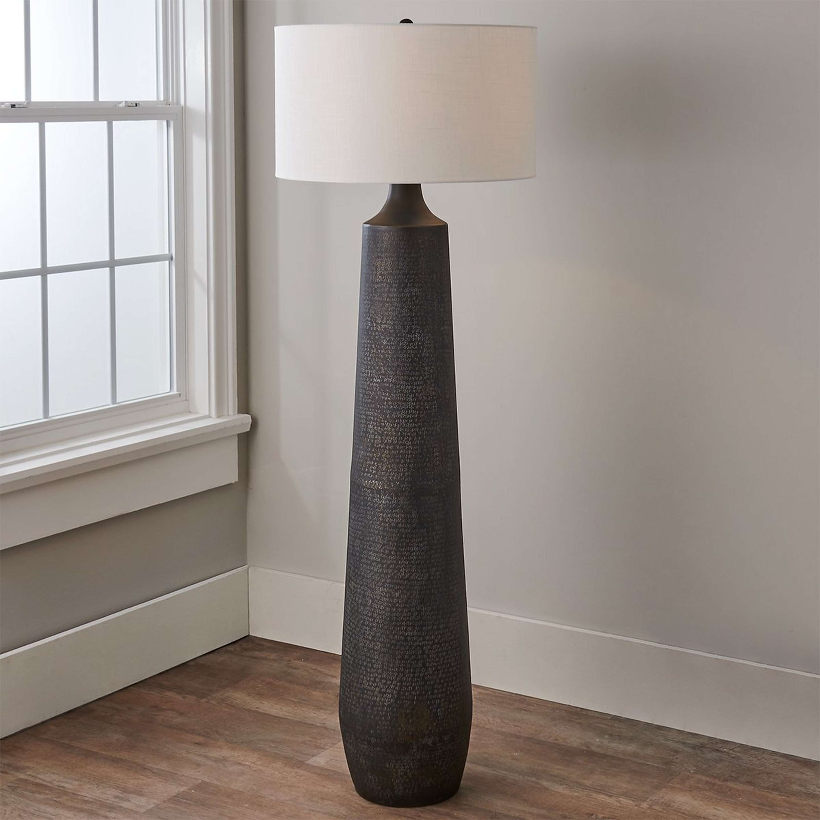 A Calhoun Floor Lamp with Antique Brass / Black / Whitewash color
