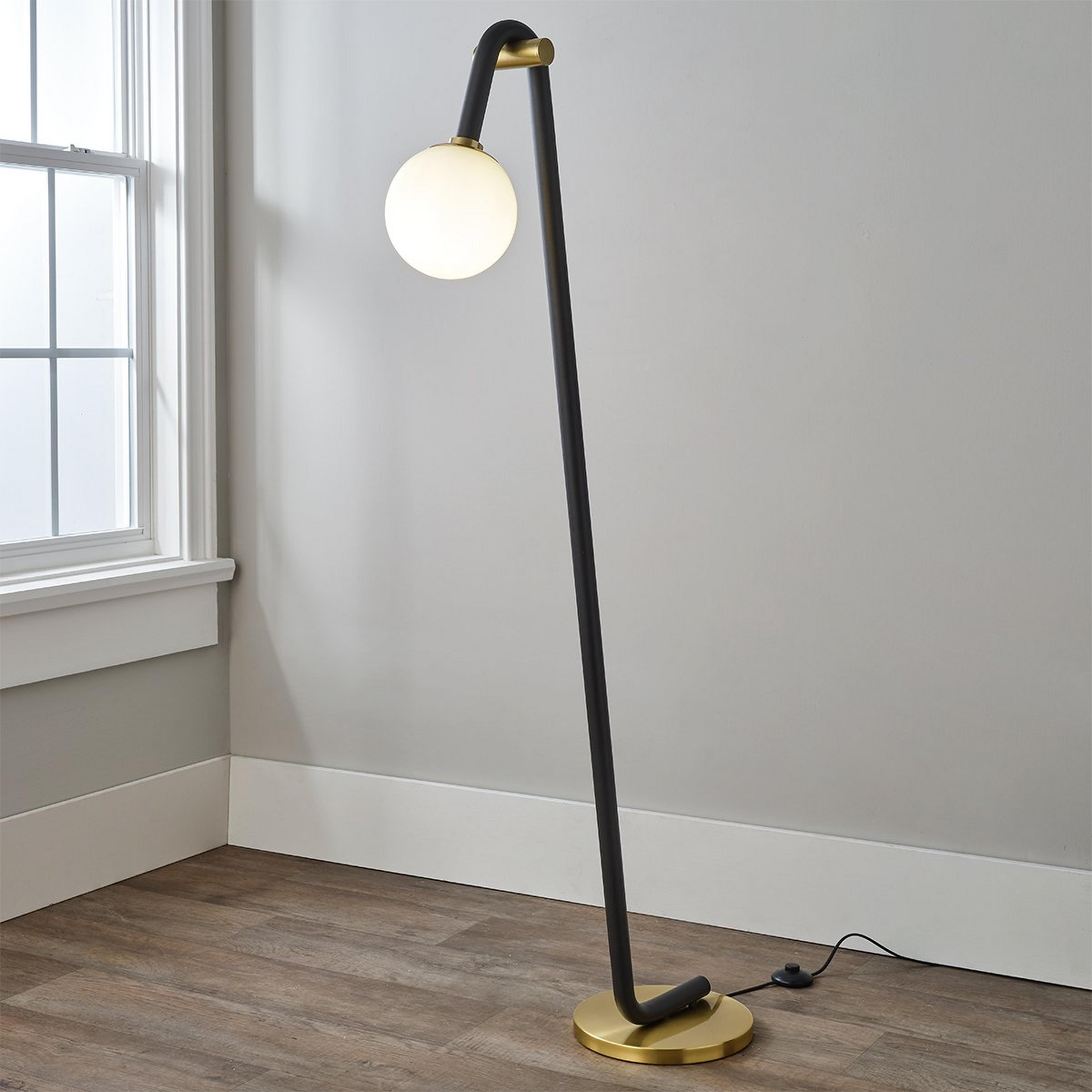 A Flexure Floor Lamp with Aged Brass / Black color