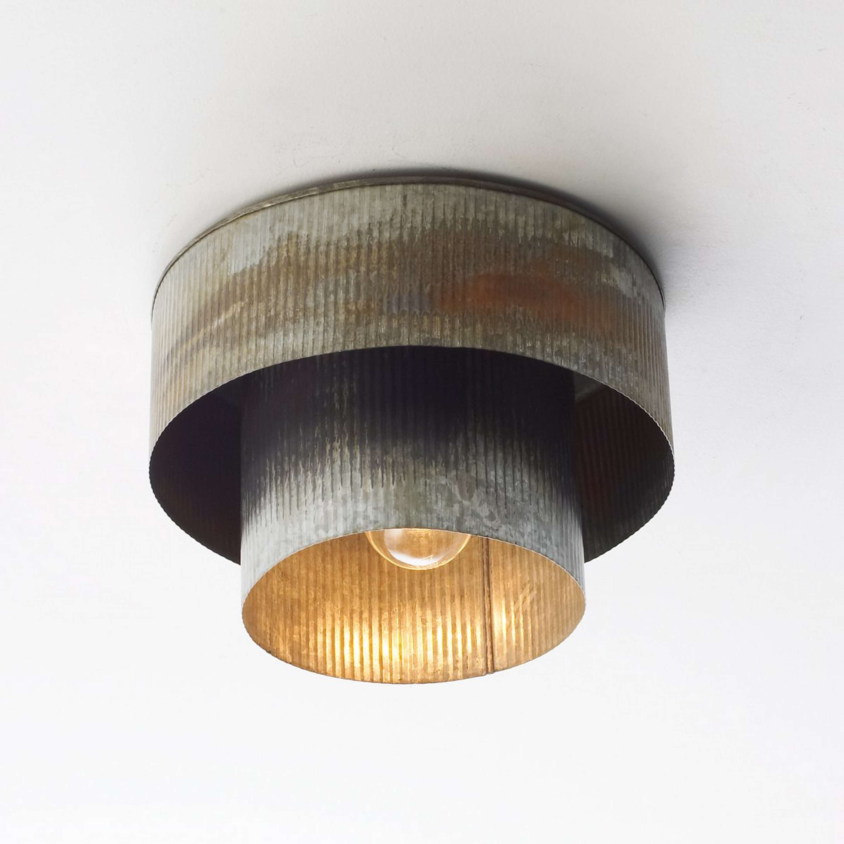 A Corrugated Tin Drum Ceiling Light with Aged Zinc color
