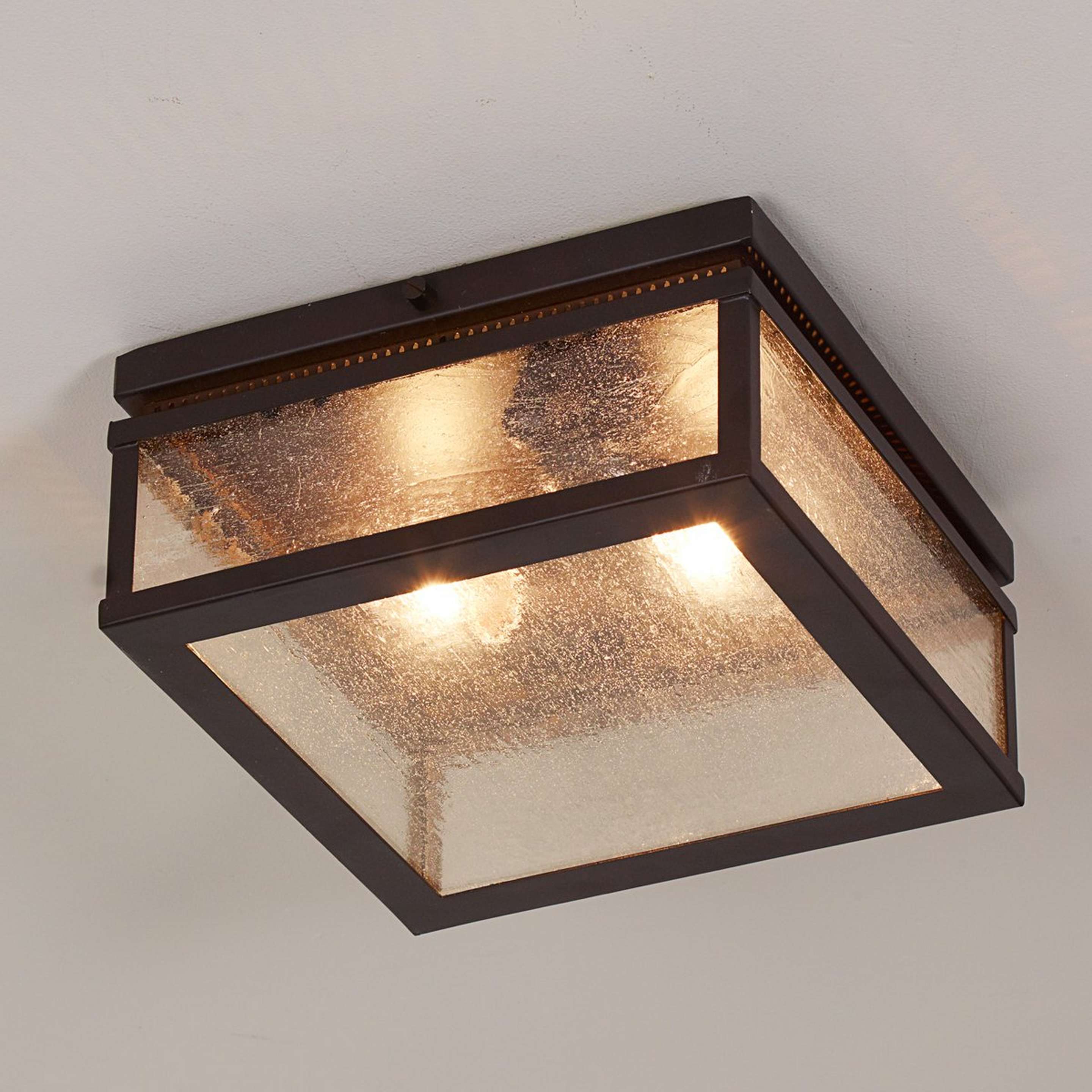 A Heritage Indoor Outdoor Ceiling Light with Bronze color