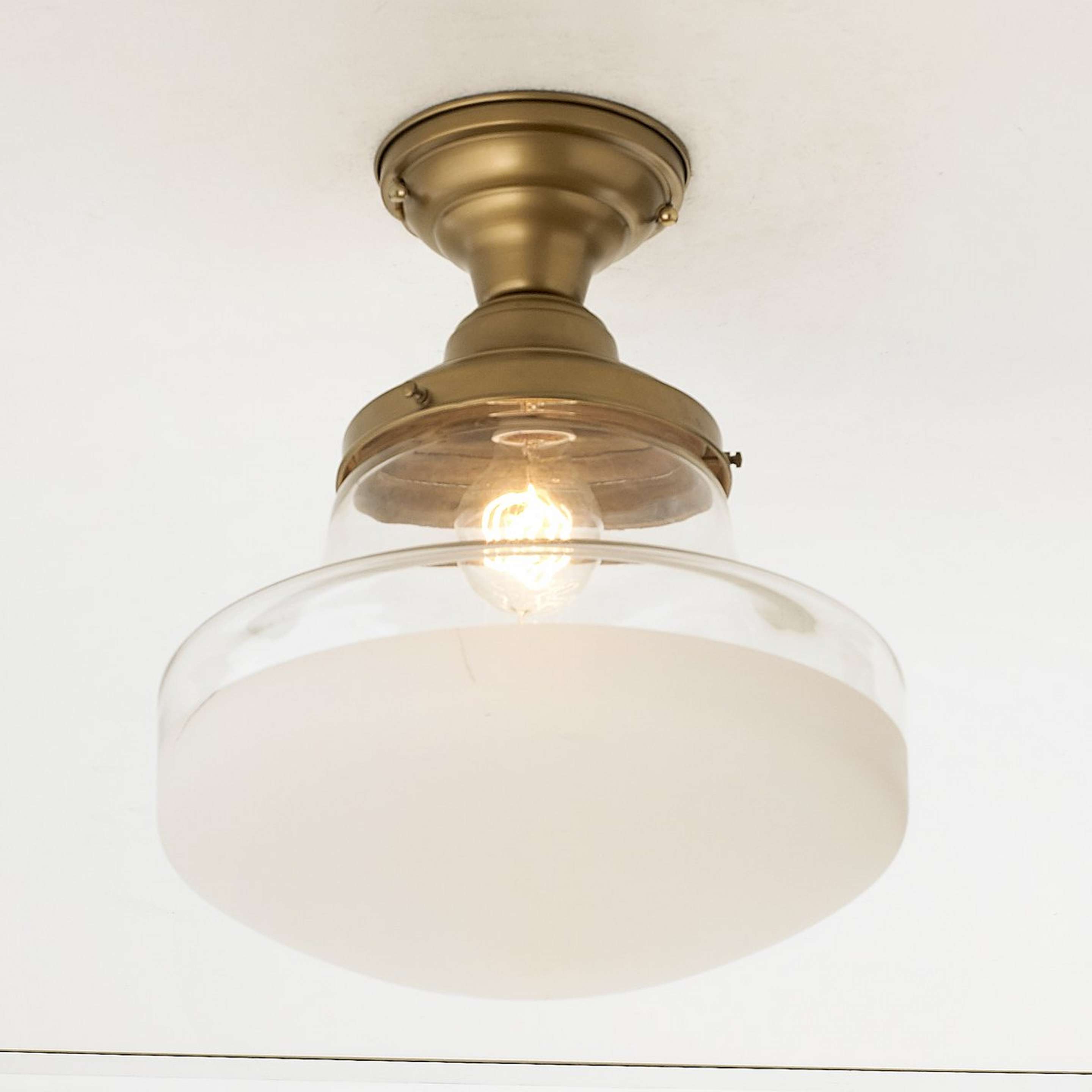 A Retro Frosted Glass Semi-Flush Ceiling Light with Antique Brass color