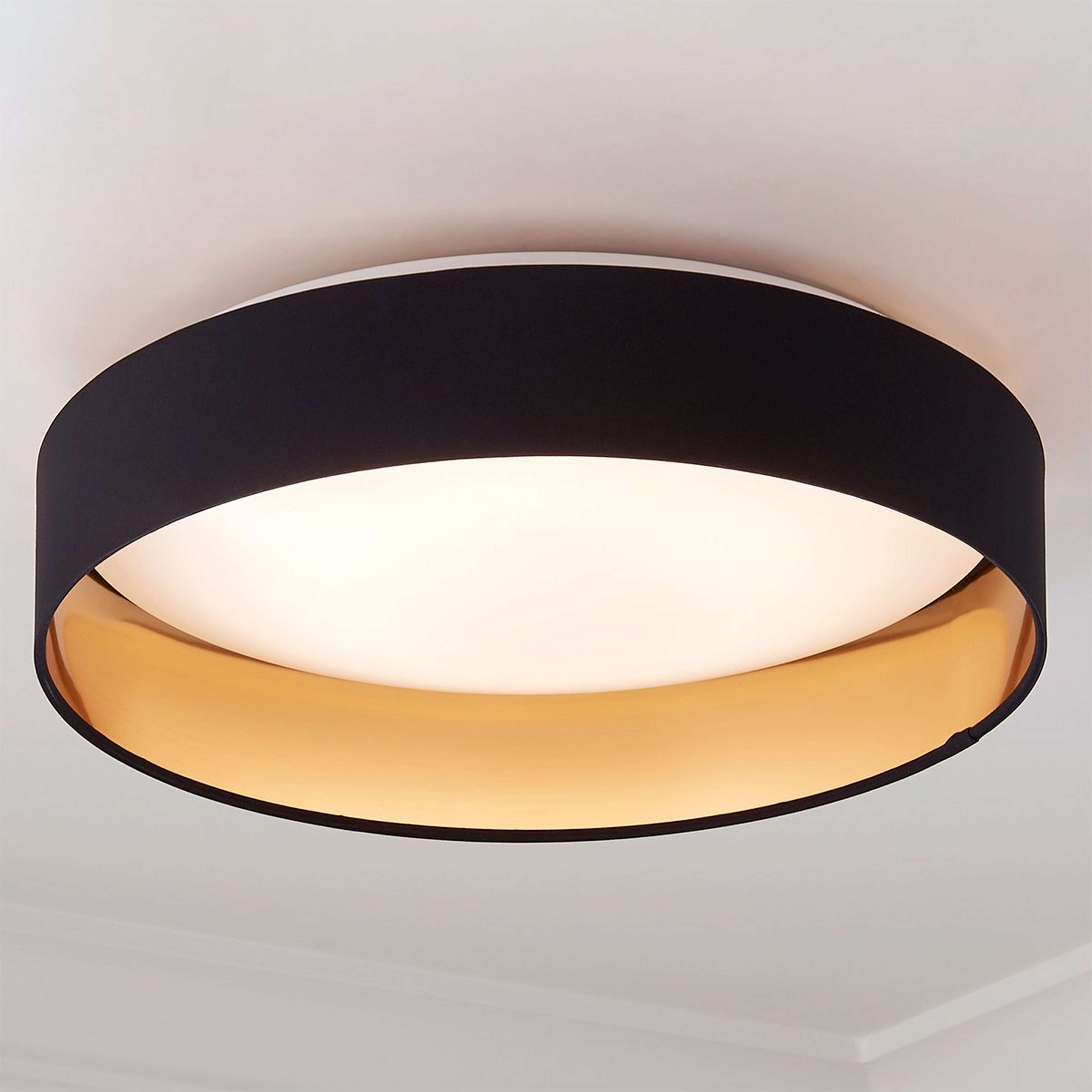 A Modern Ringed LED Ceiling Light with Black / Gold color