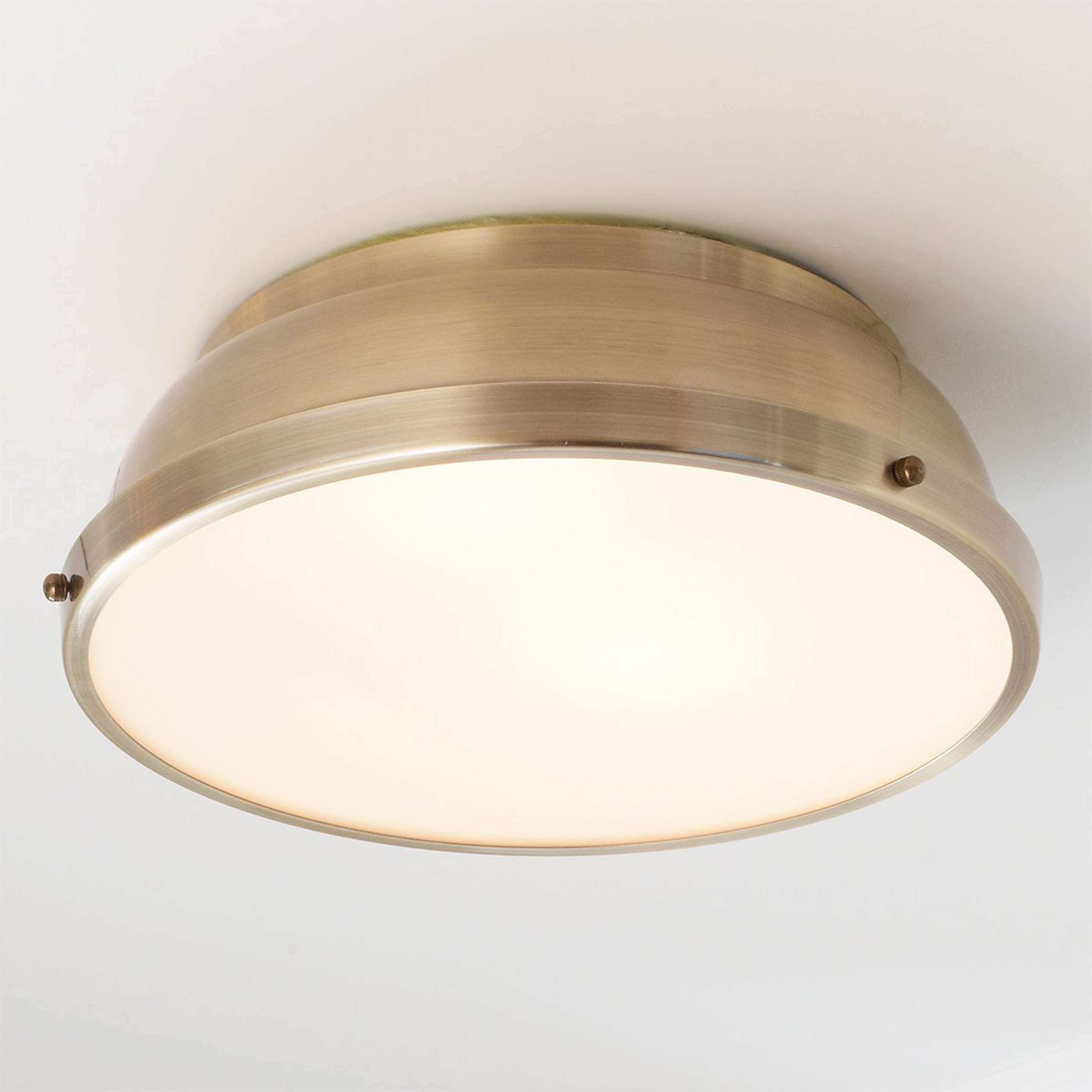 A Classic Dome Metal Ceiling Light with Aged Brass color