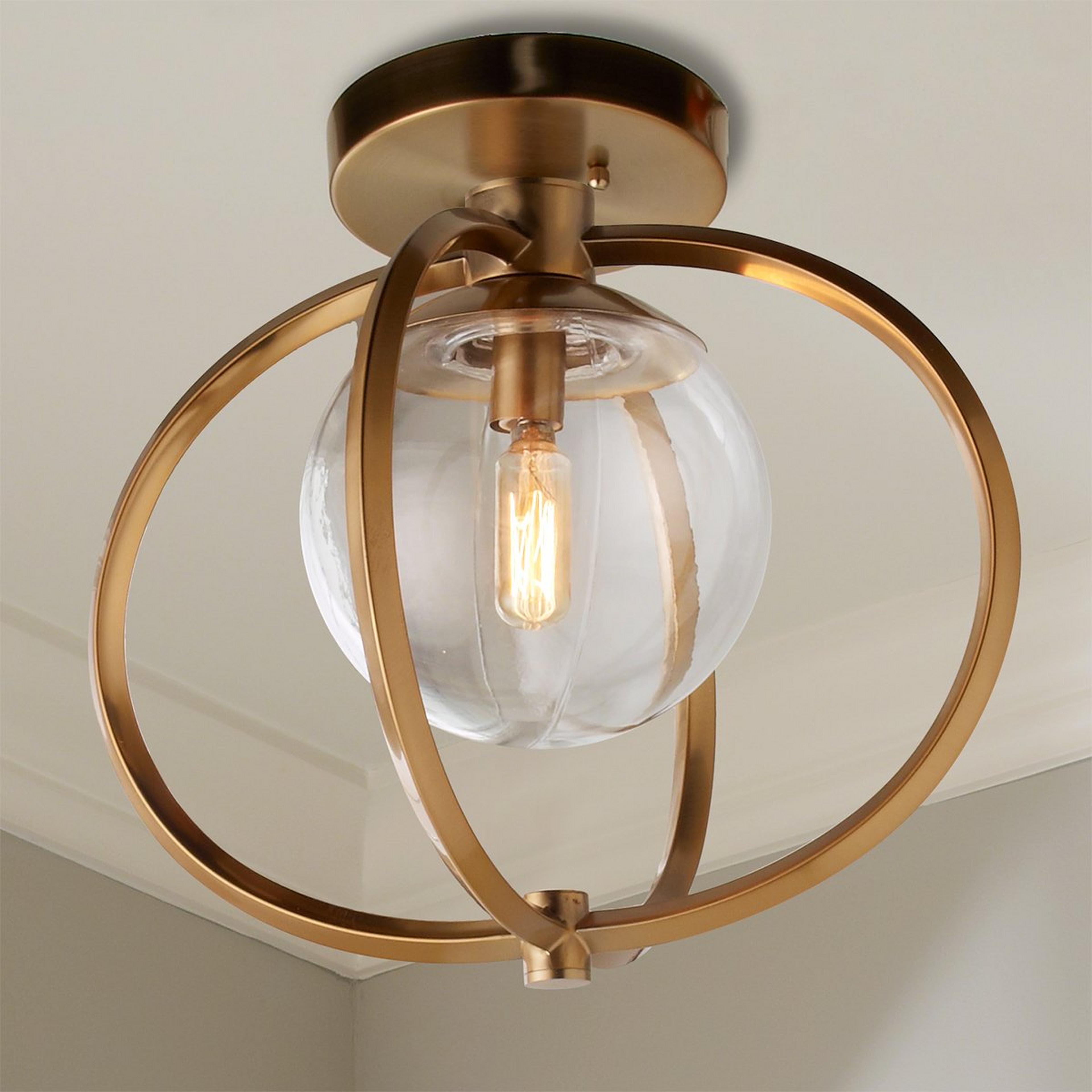 A Captured Sphere Ceiling Light with Satin Brass color