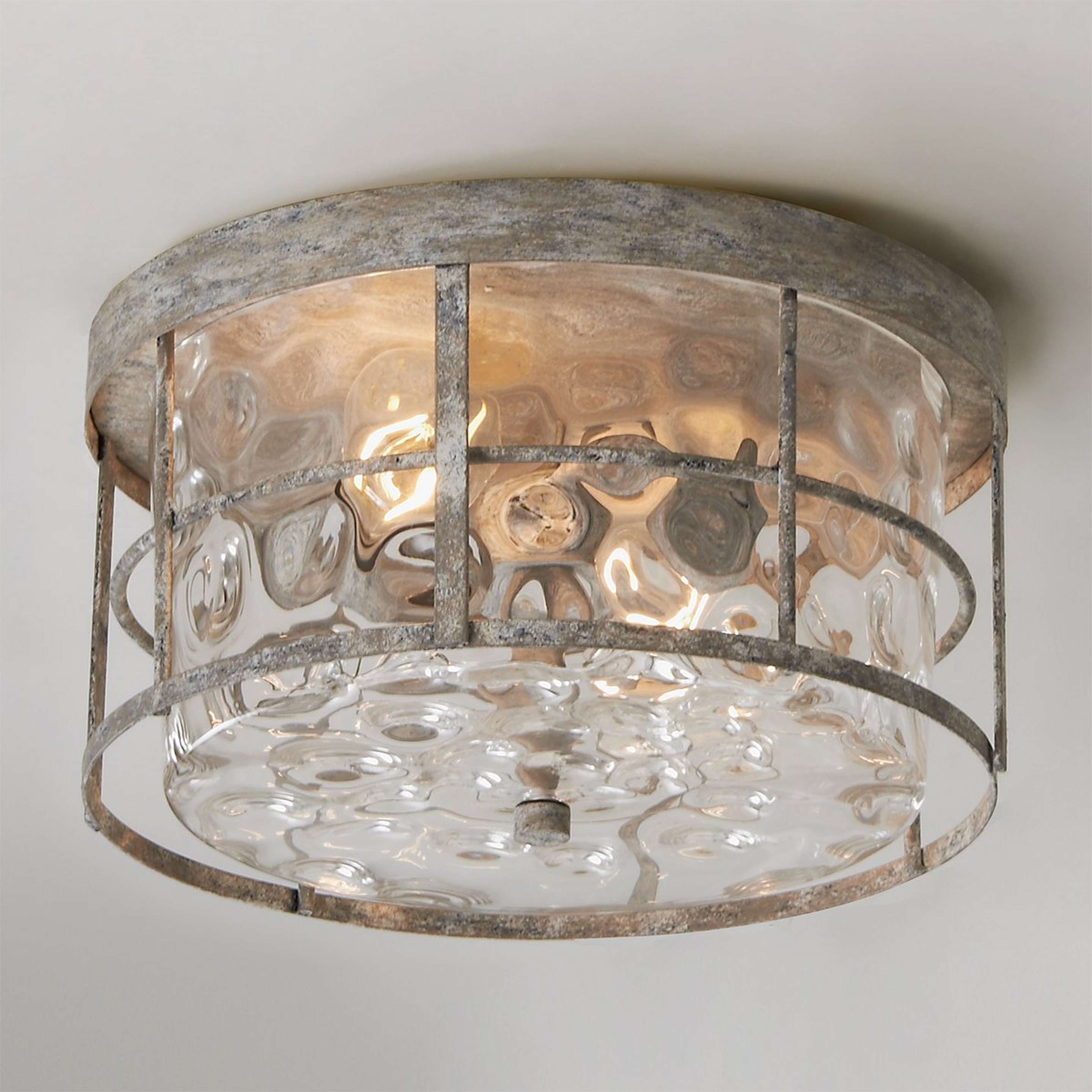A Coastal Cottage Ceiling Light with Distressed Cream color