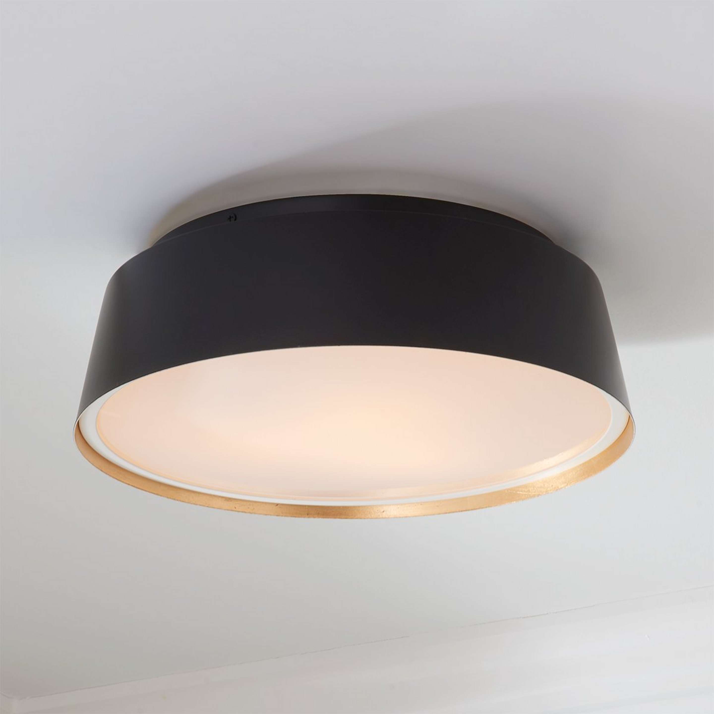 A ED Ellen DeGeneres Asher 3 Light Flush Mount with Midnight Black / Gold Leaf color