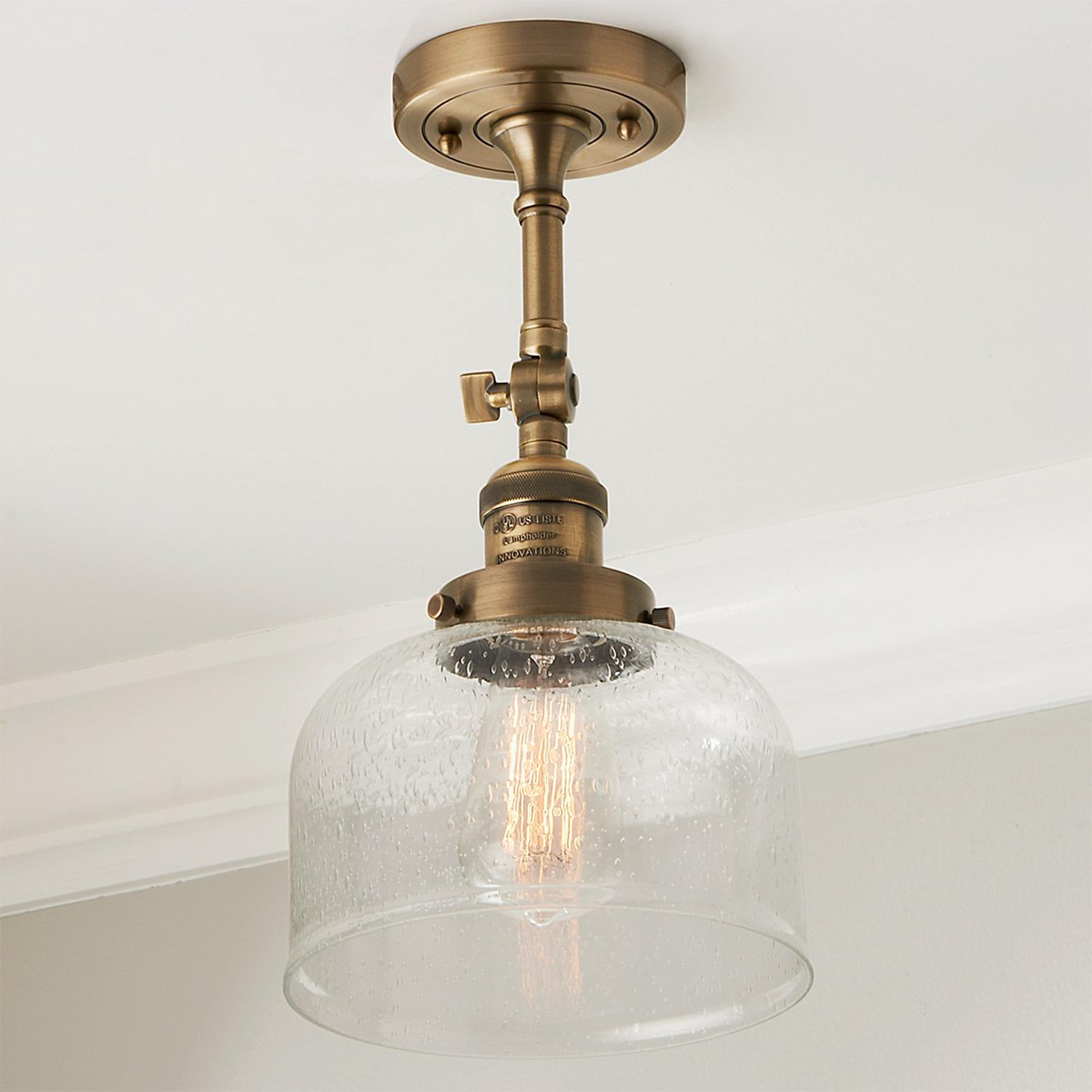 A Kelsey Convertible Ceiling Light - Dome Seeded with Antique Brass / Clear Seeded Glass color