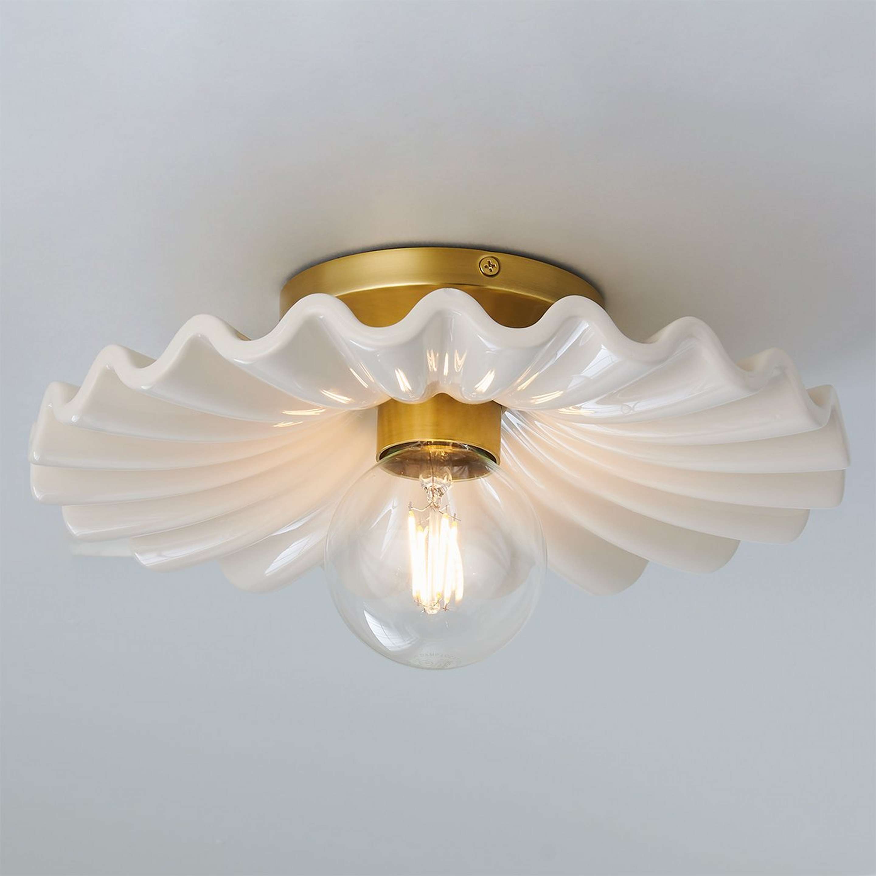 A Primula Ceiling Light with Aged Brass / Cream color
