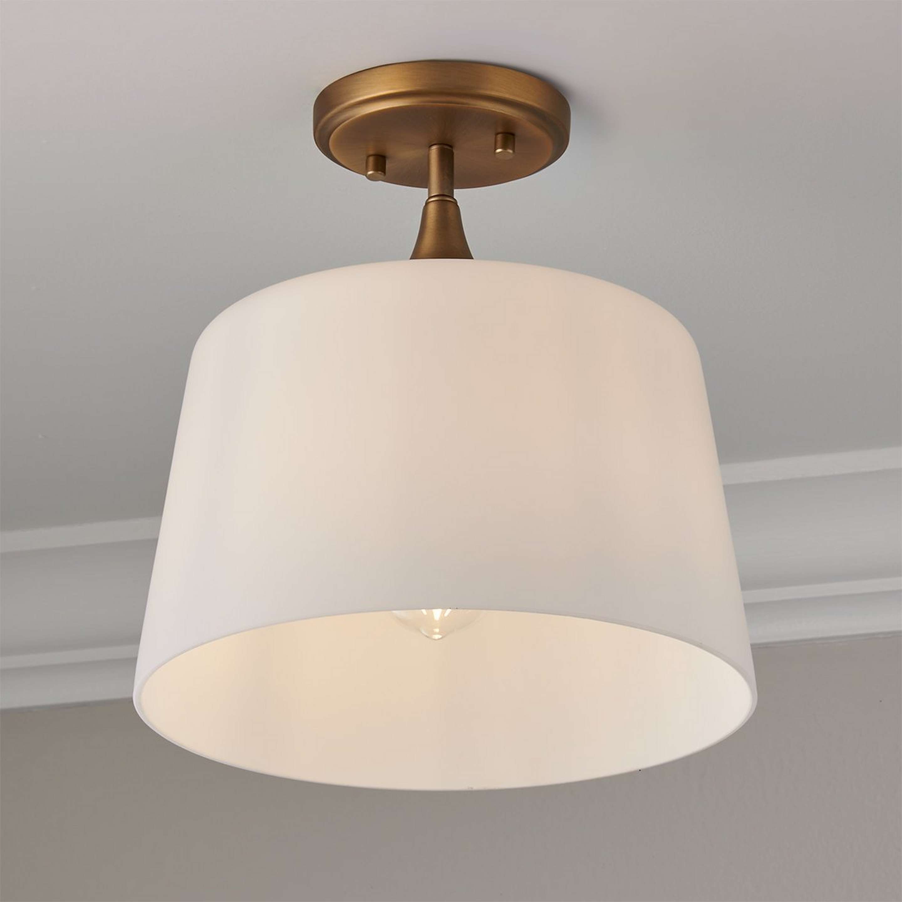A Mayhue Convertible Semi-Flush Ceiling Light with Aged Brass / Milk Glass color