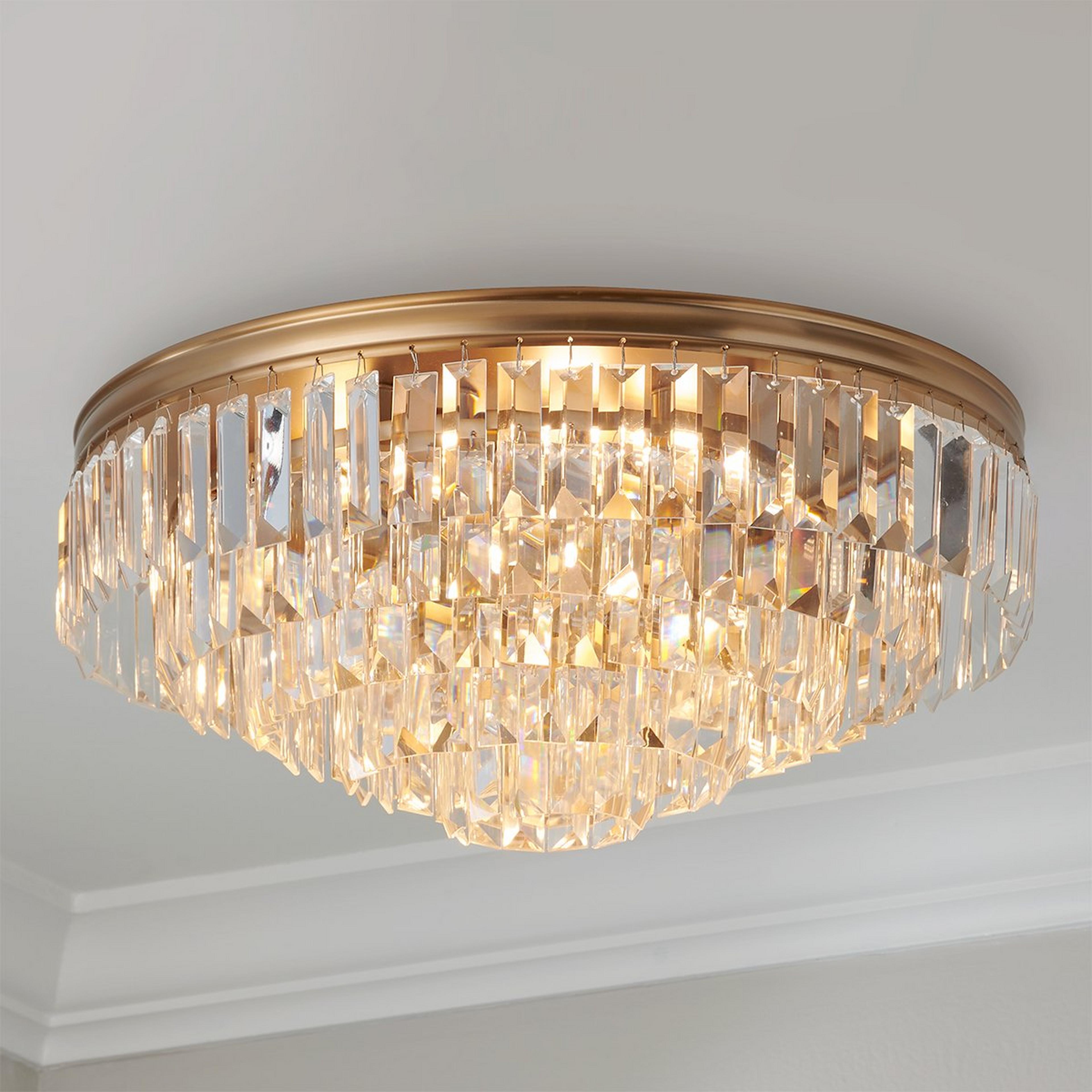 A Faceted Glass Layered Ceiling Light with Gold color