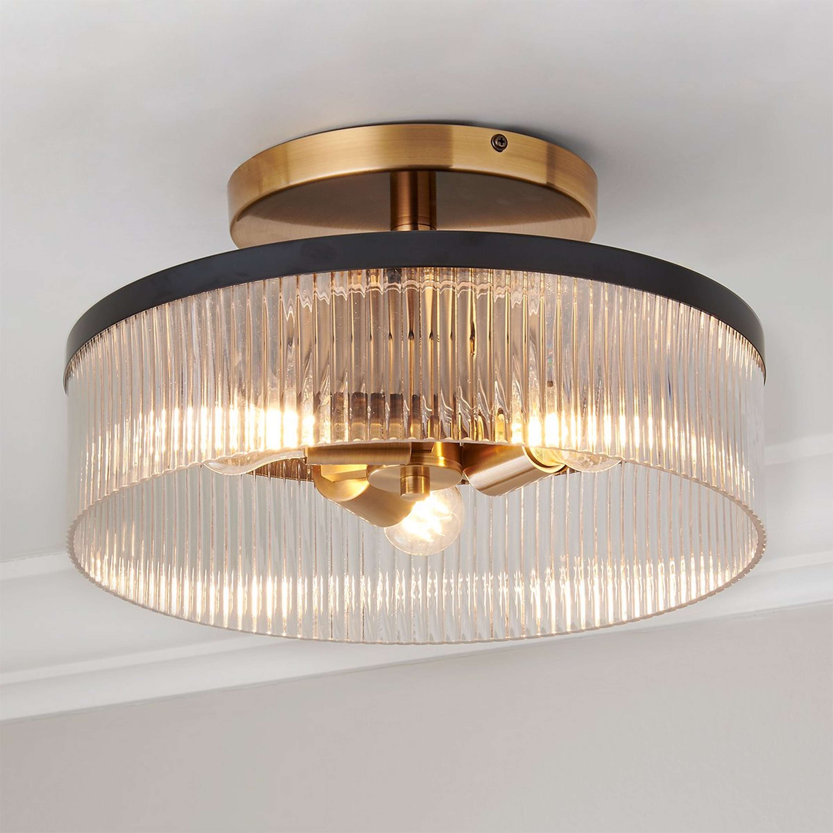 A Novara Semi-Flush Ceiling Light with Gold / Black / Fluted Glass color