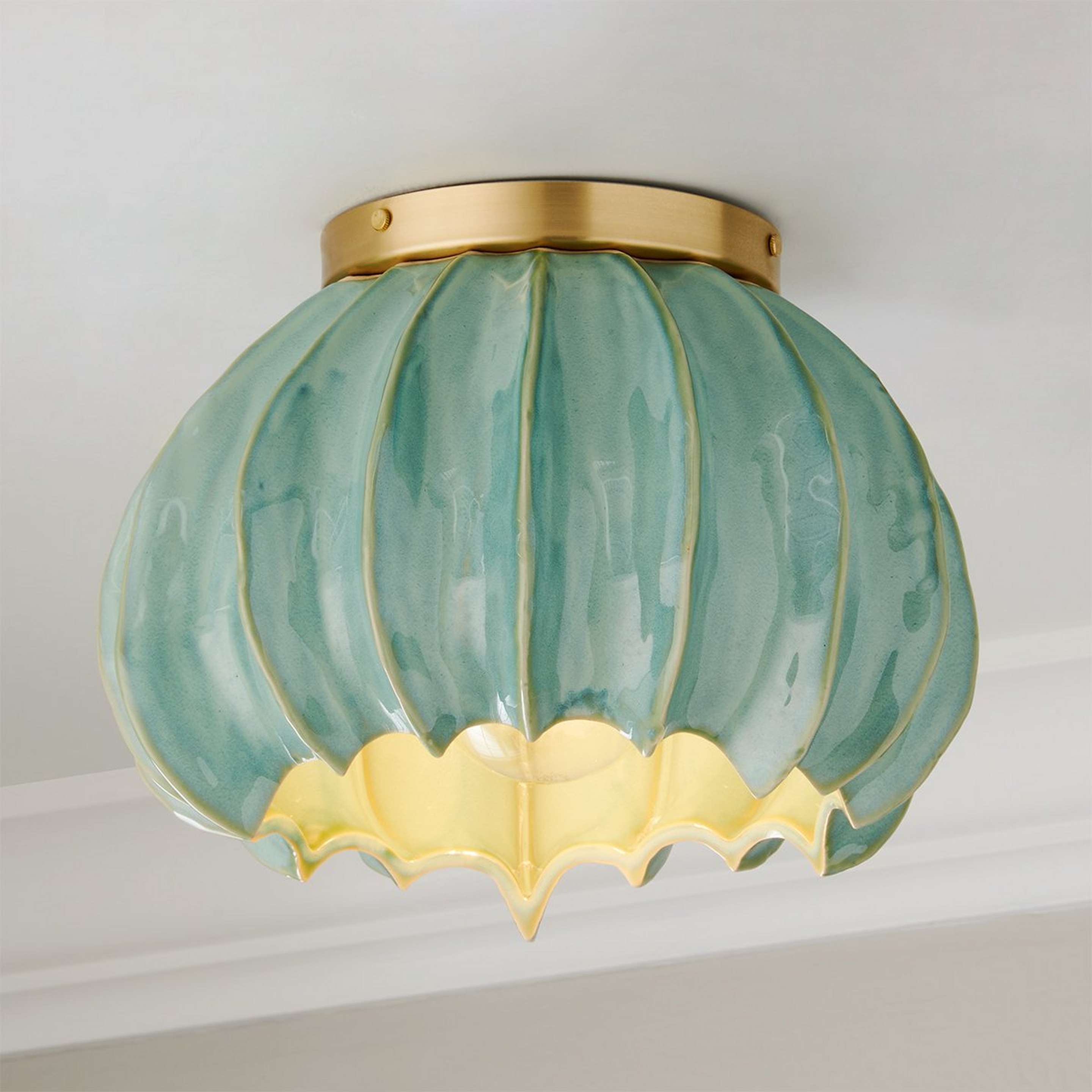 A Thalassa Ceiling Light with Brushed Brass / Aqua color