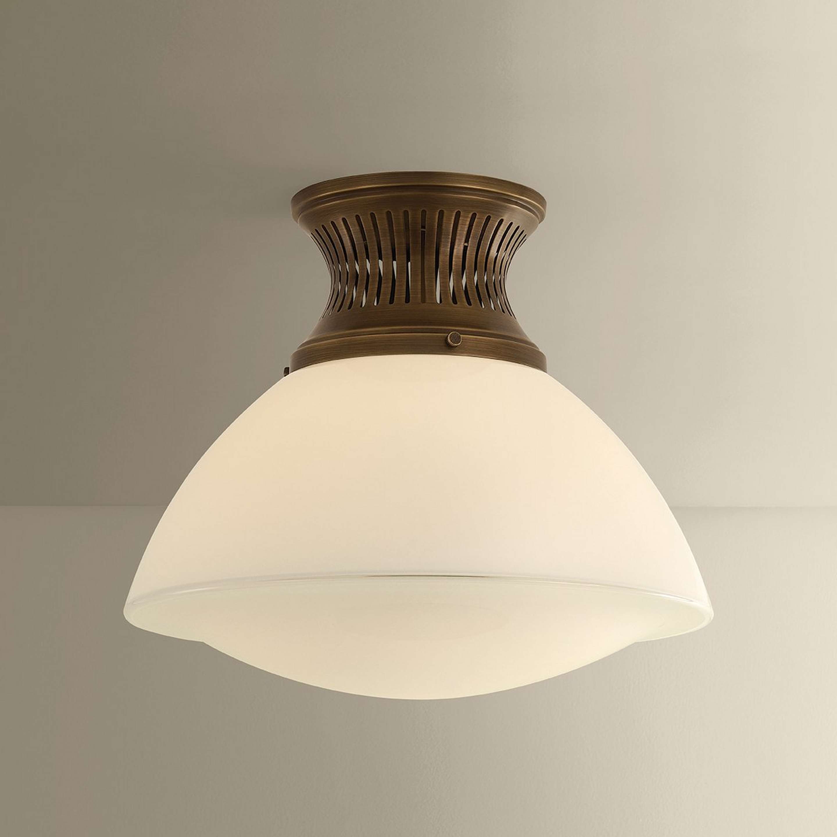 A Rigel Ceiling Light with Bronze / Opal Glass color