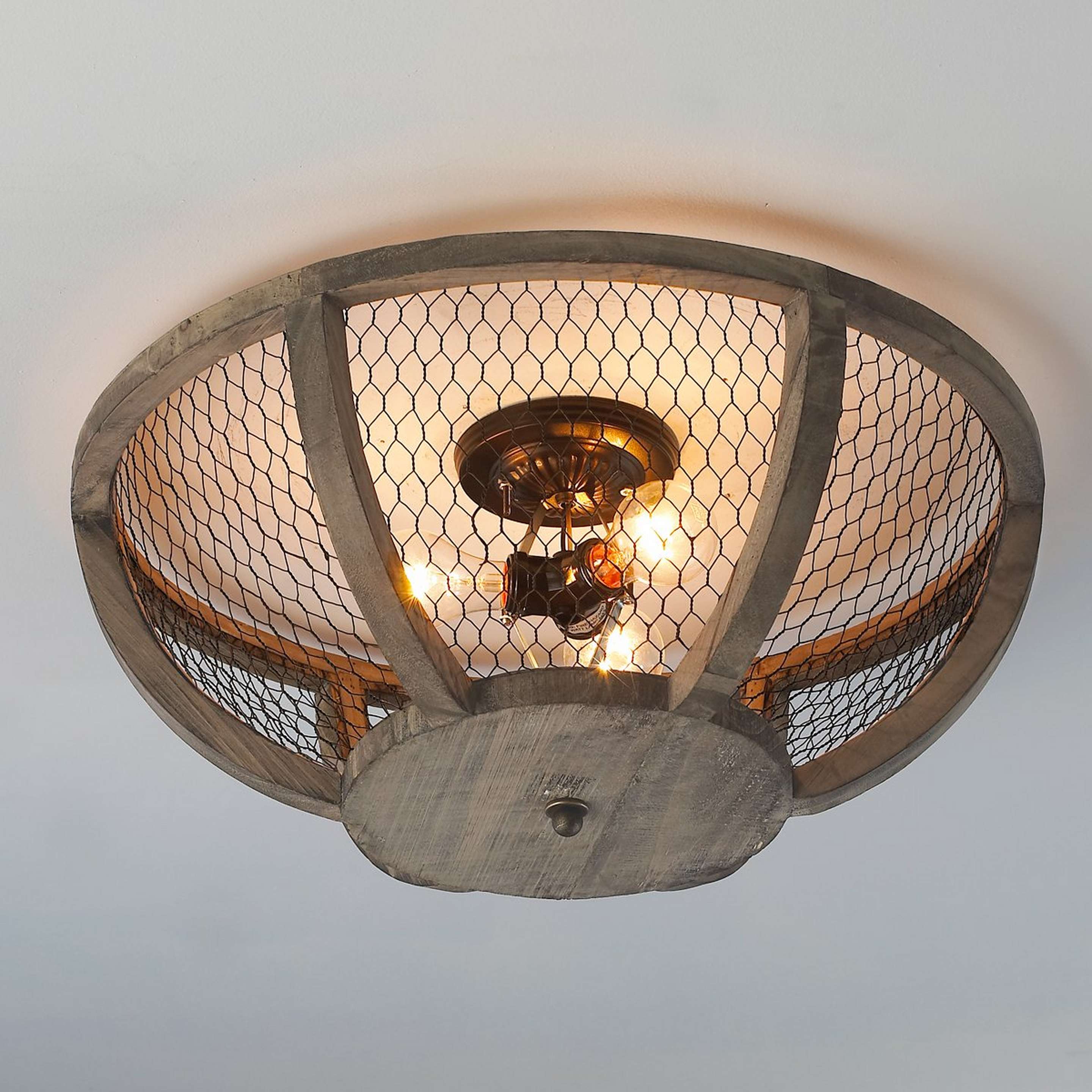 A Chicken Wire Basket Ceiling Light - Small with Bronze color