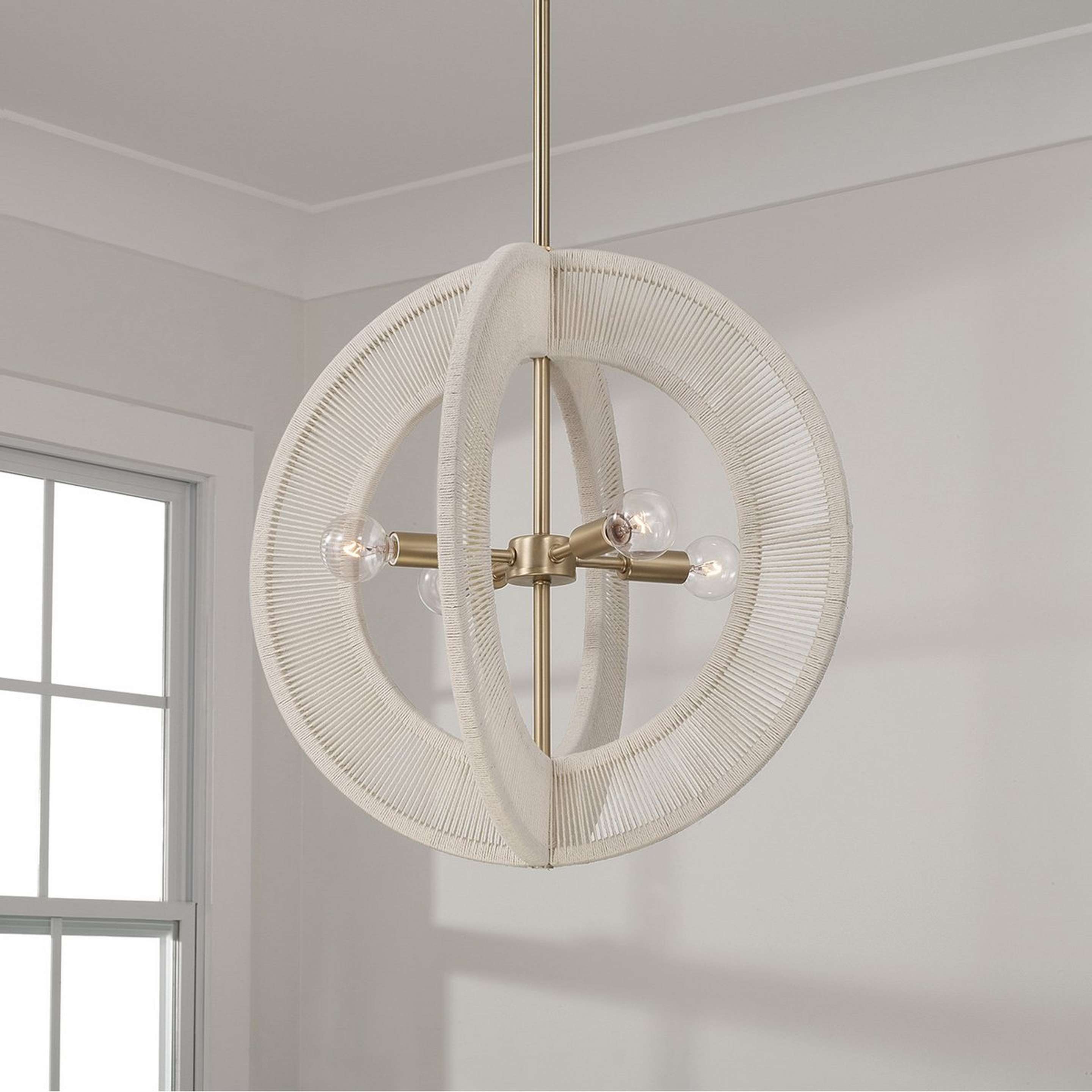 A Kalini Lantern with Matte Brass / Bleached Natural Rope color