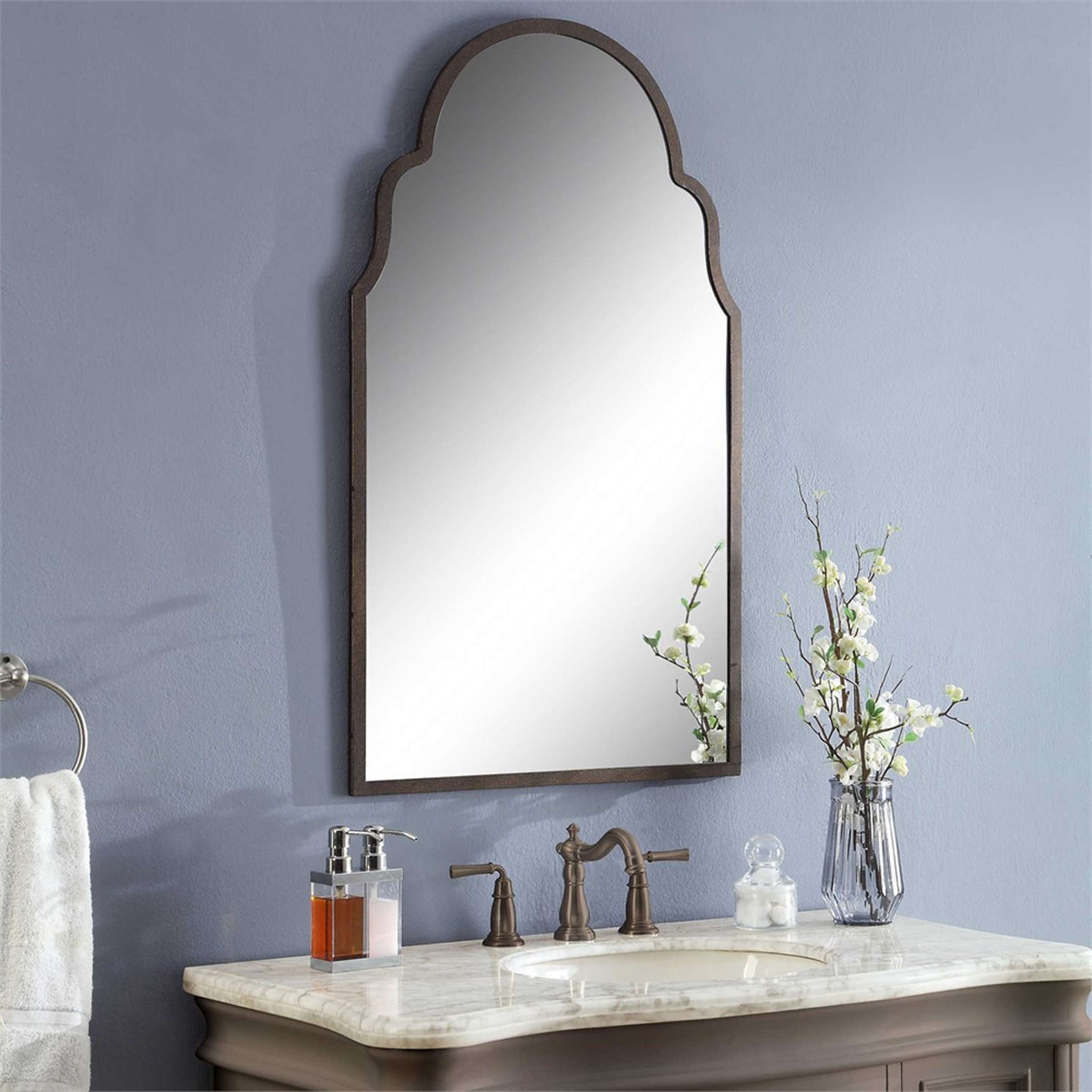 A Shapely Silhouette Metal Mirror with Burnished Metal color