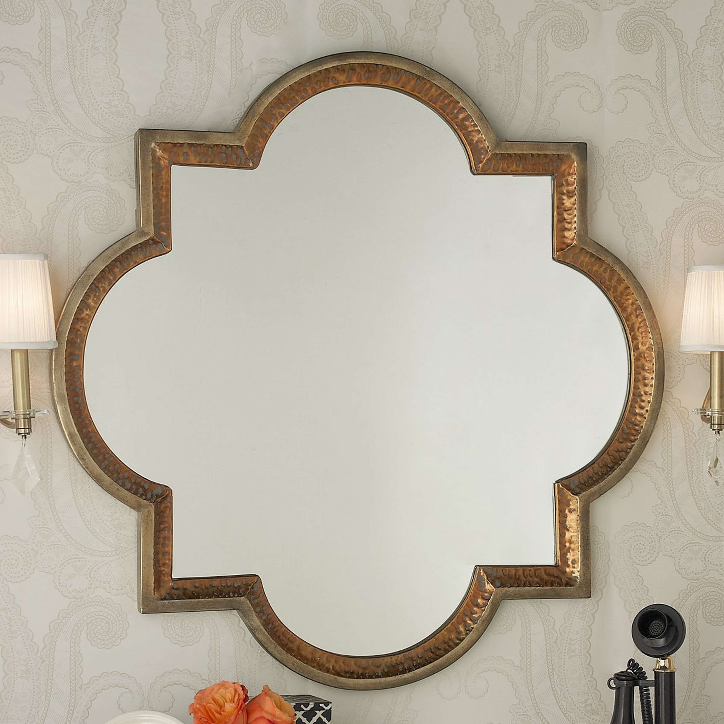 A Gold and Copper Quatrefoil Mirror with Antiqued Gold color