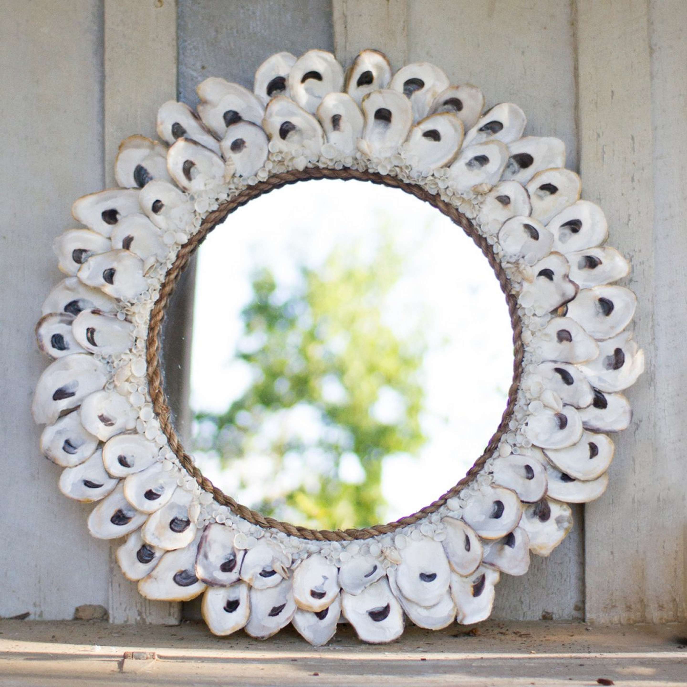 A Round Oyster Shell Mirror with Natural color