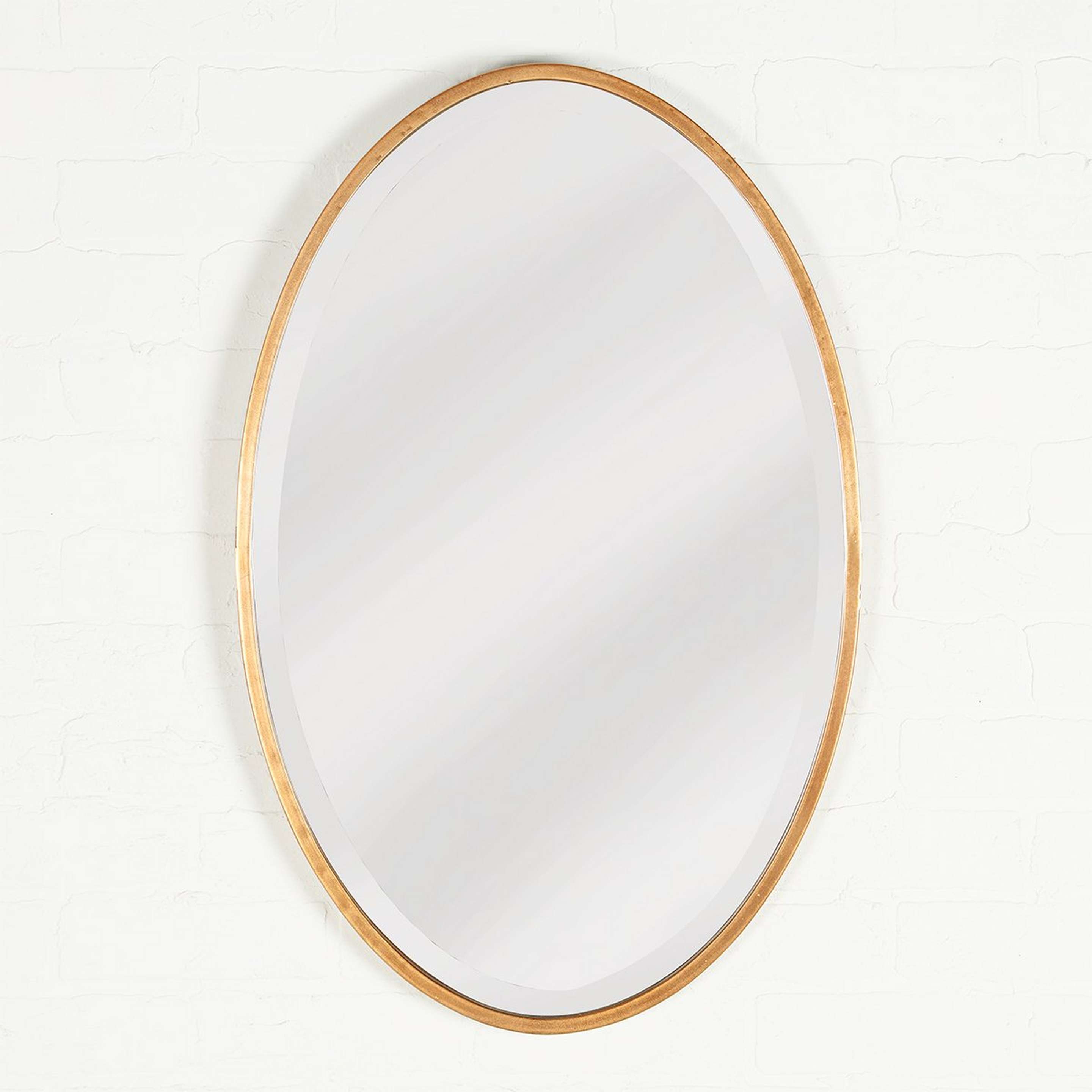 A Minimalist Modern Gold Mirror with Antique Gold color