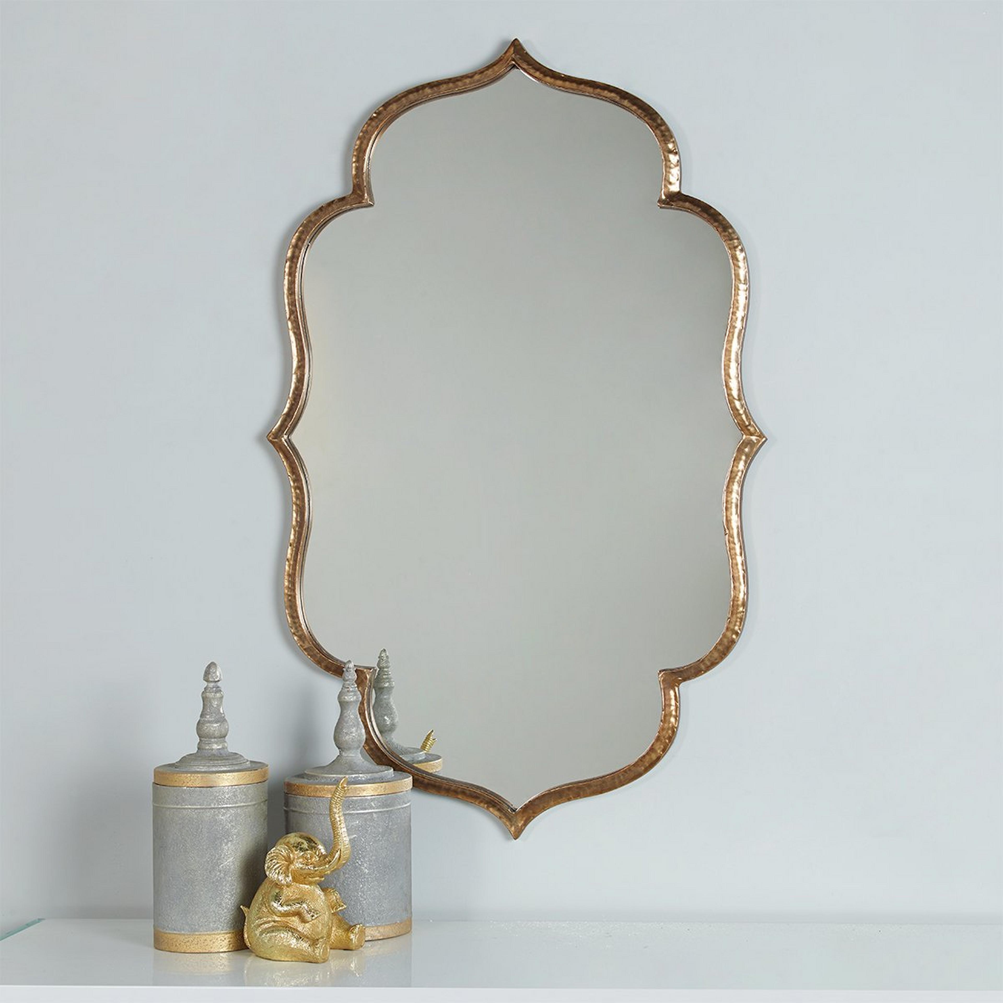 A Luxe Bohemian Mirror with Gold color