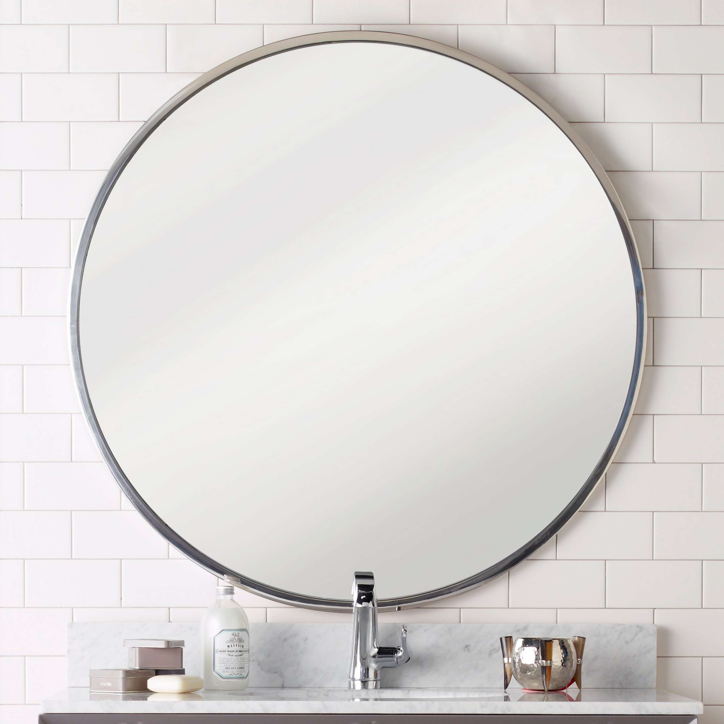 A Perfectly Round Mirror with Stainless Steel color
