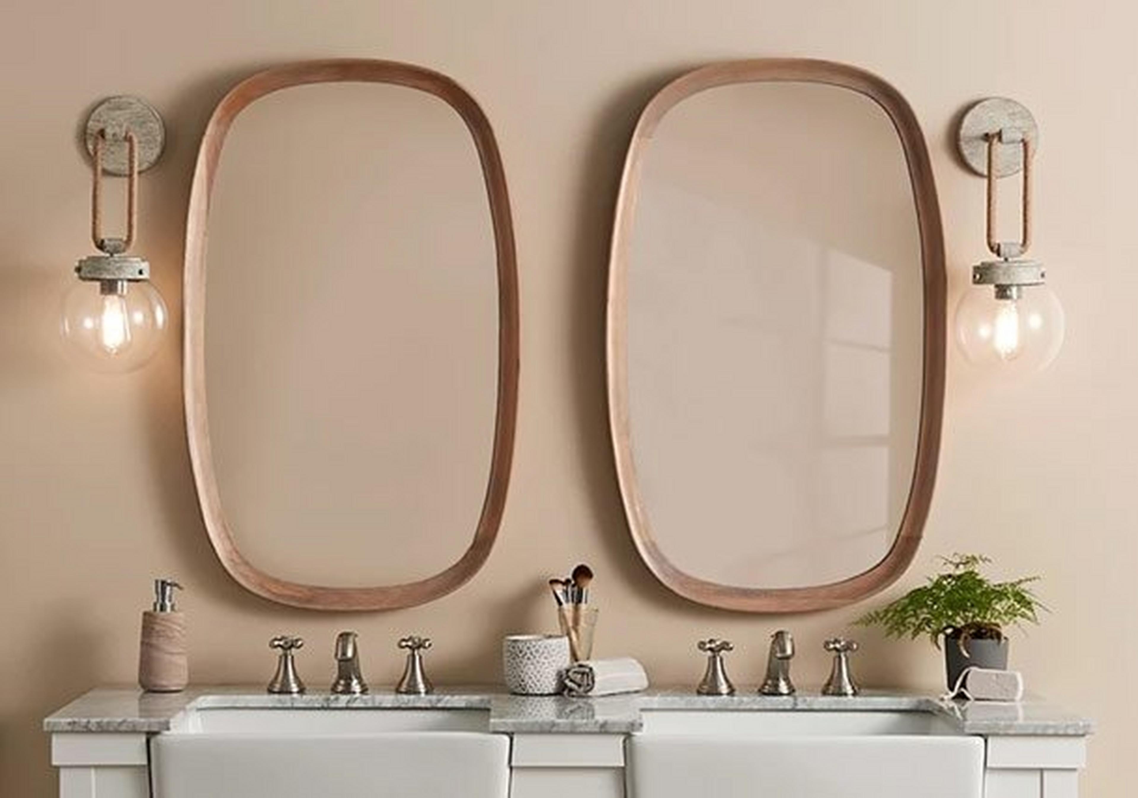 Three soho sconces on a gray wall