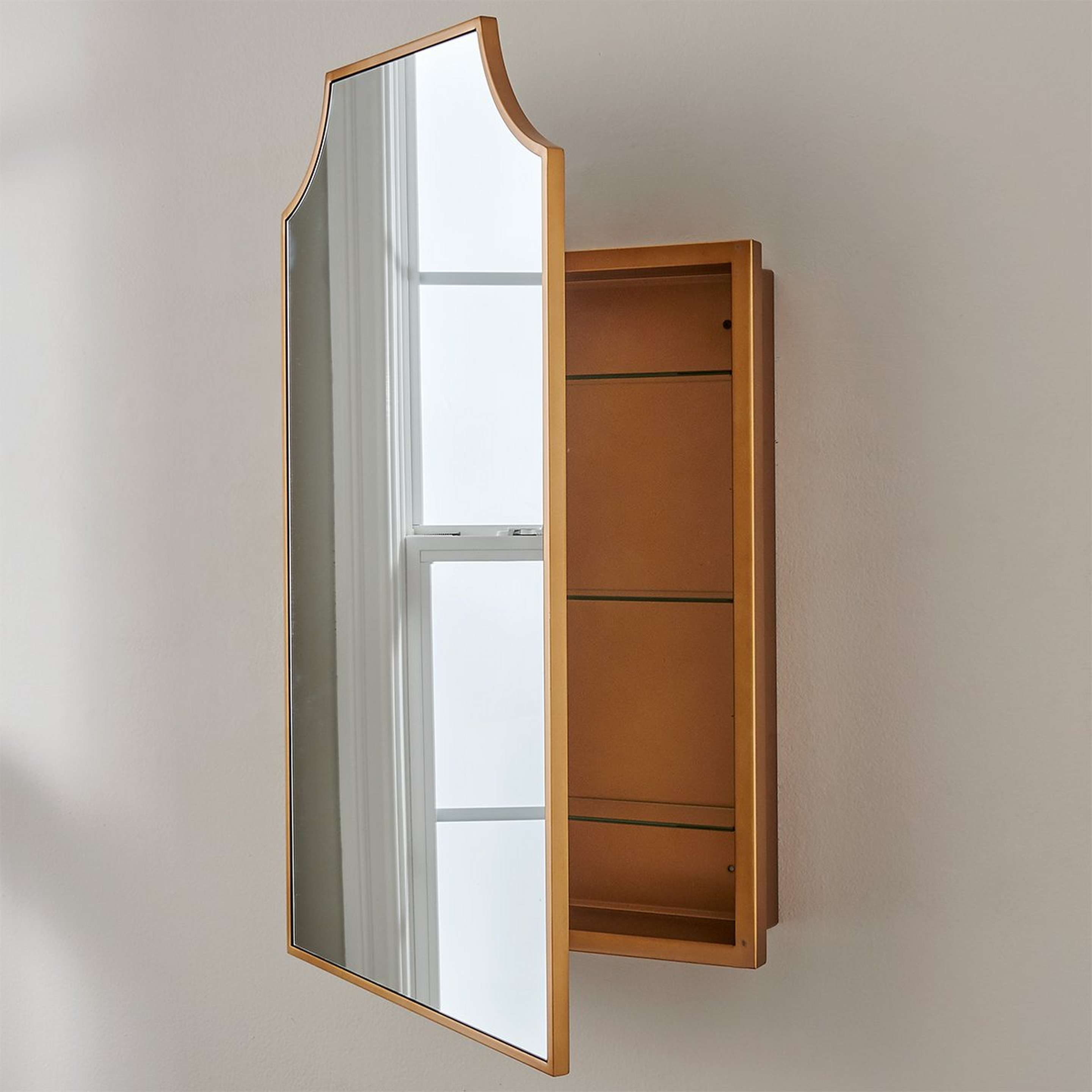 A Sylvayn Medicine Cabinet Mirror with Gold color