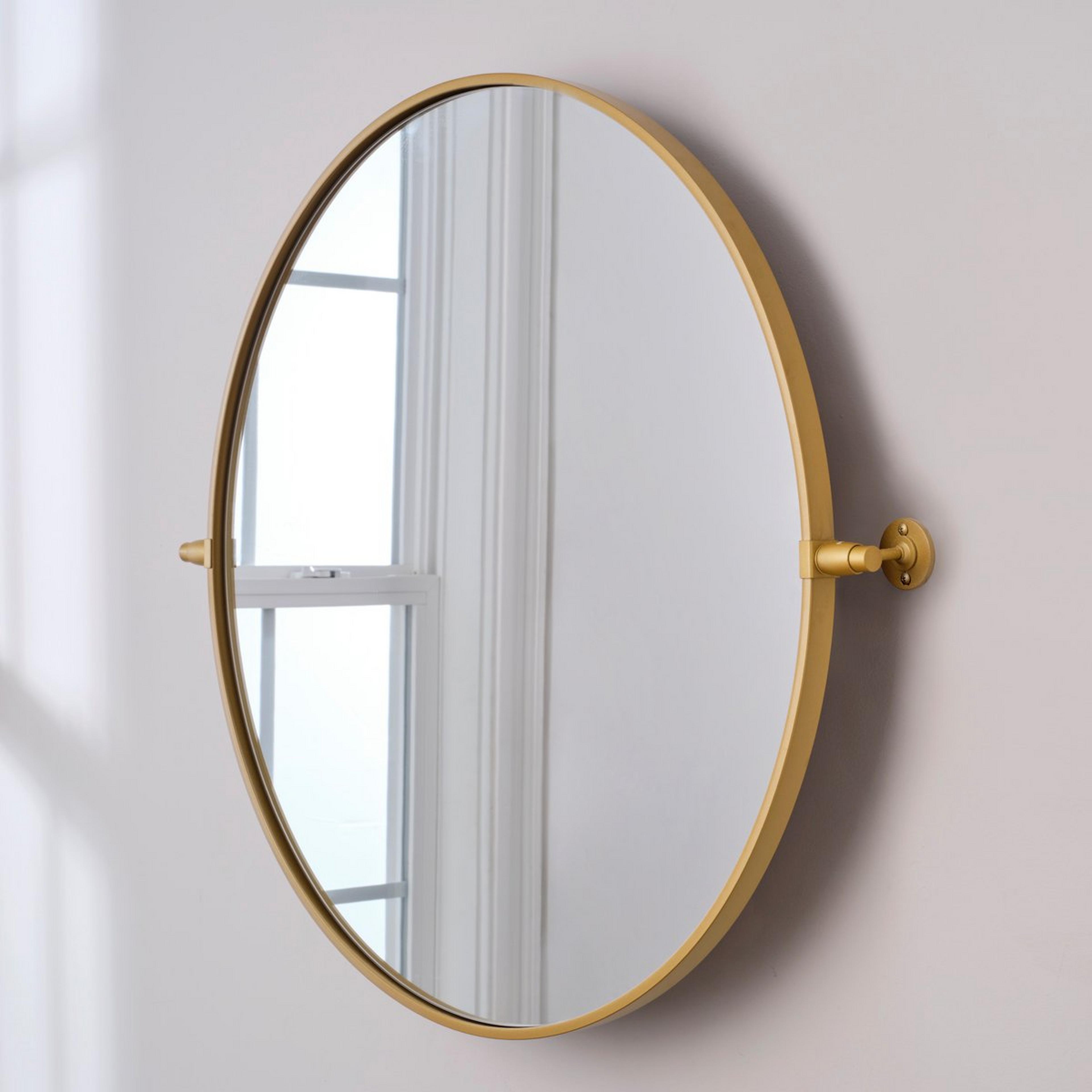 A Heathfield Round Tilt Mirror - Large with Brass color