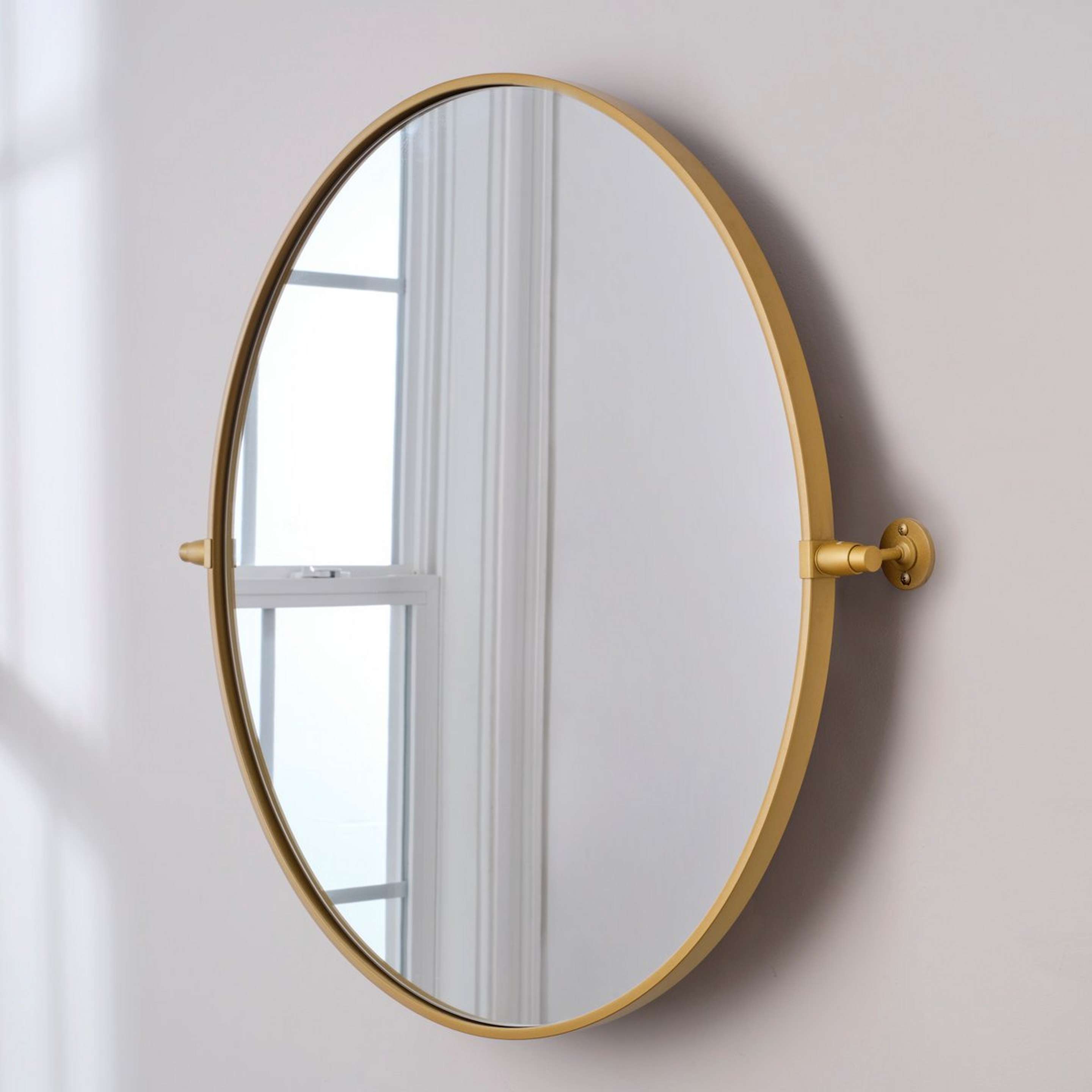 A Heathfield Round Tilt Mirror - Large with Brass color