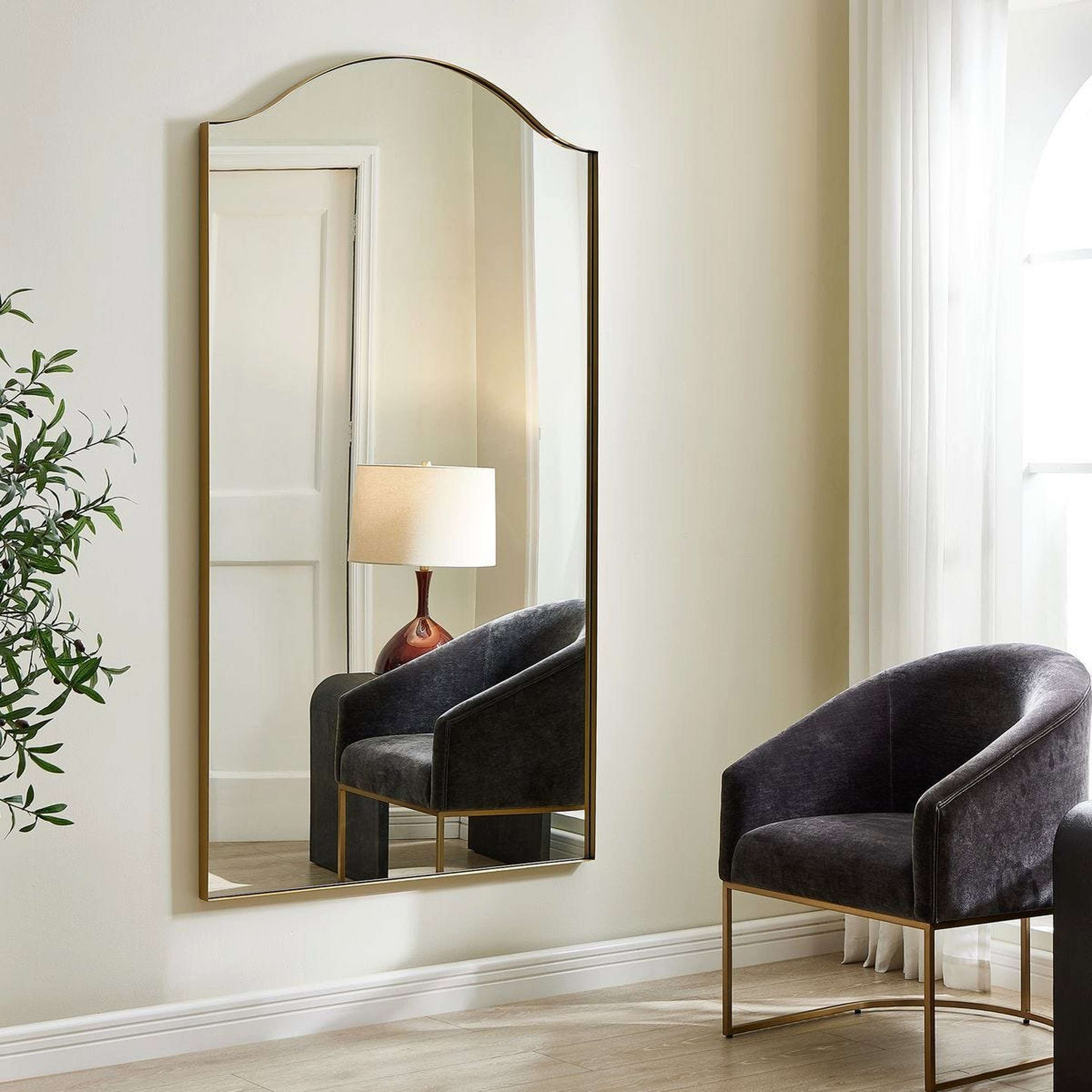 A Arista Mirror with Brushed Brass color