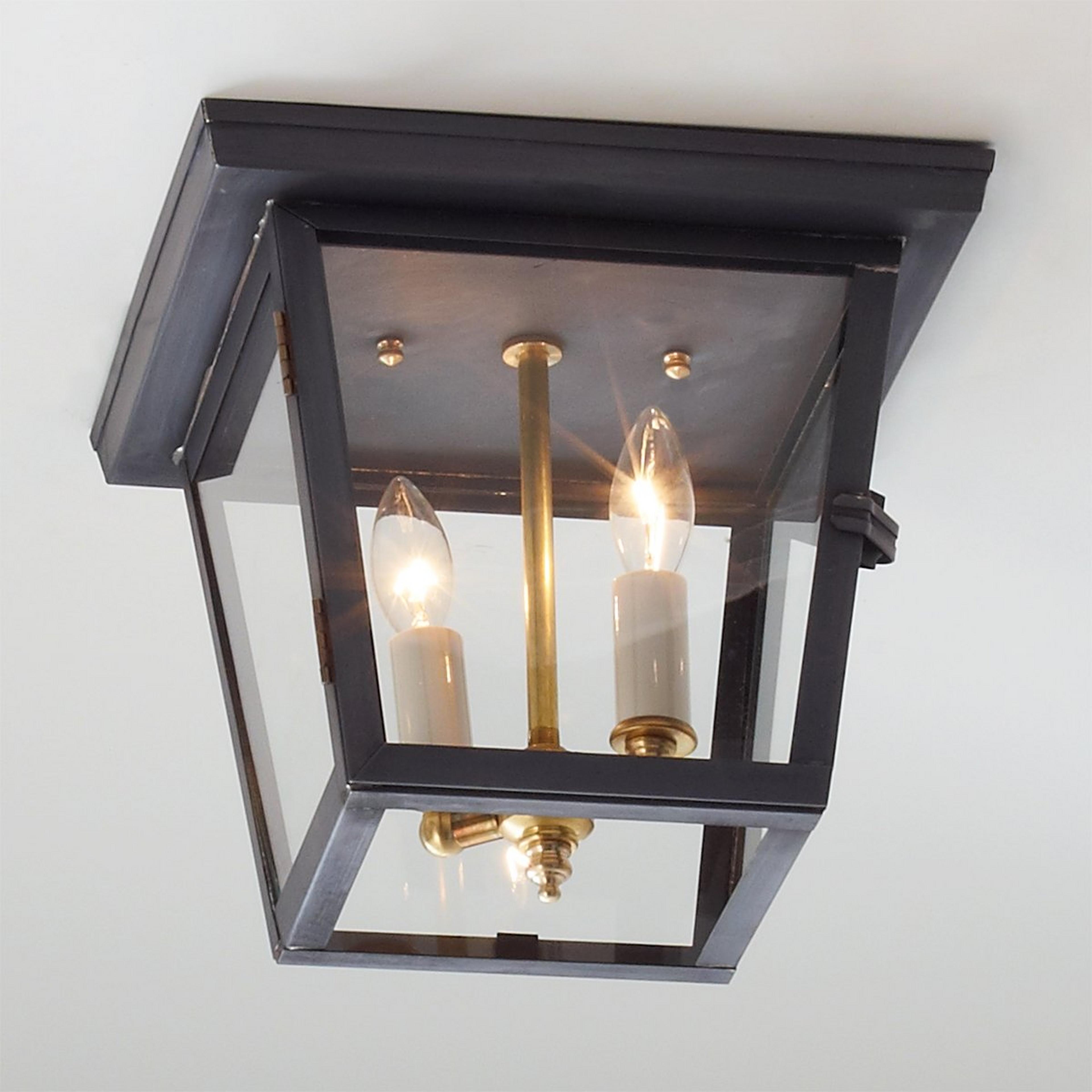 A Colonial Metalcrafts Richmond Outdoor Ceiling Light with Darkened Copper / Clear Glass  color