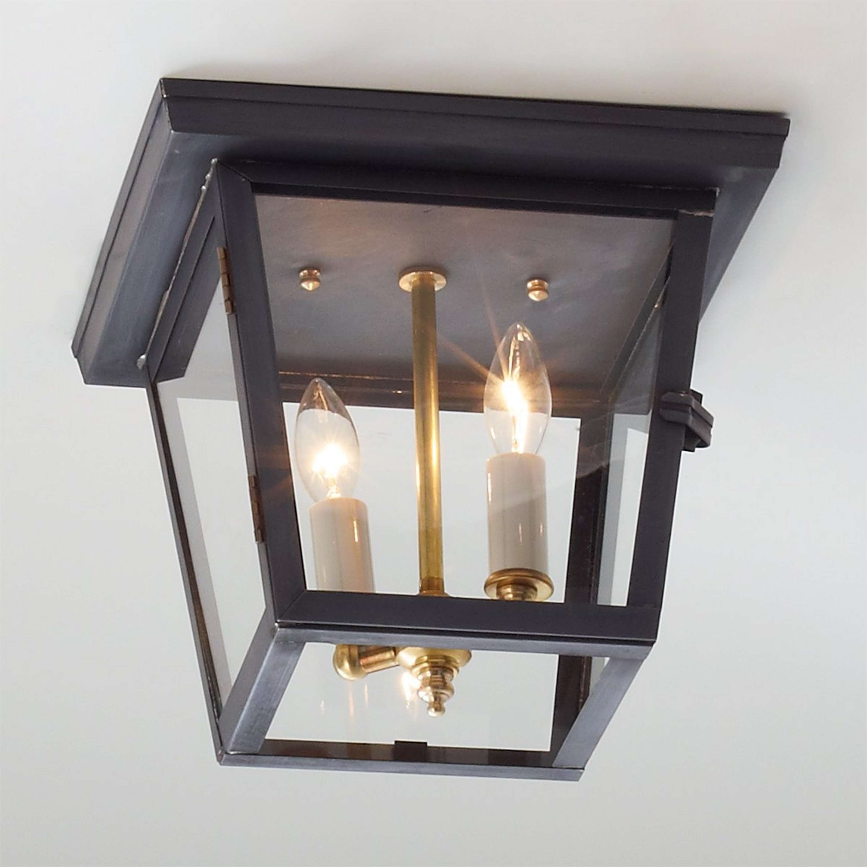 A Colonial Metalcrafts Richmond Outdoor Ceiling Light with Darkened Copper / Clear Glass color