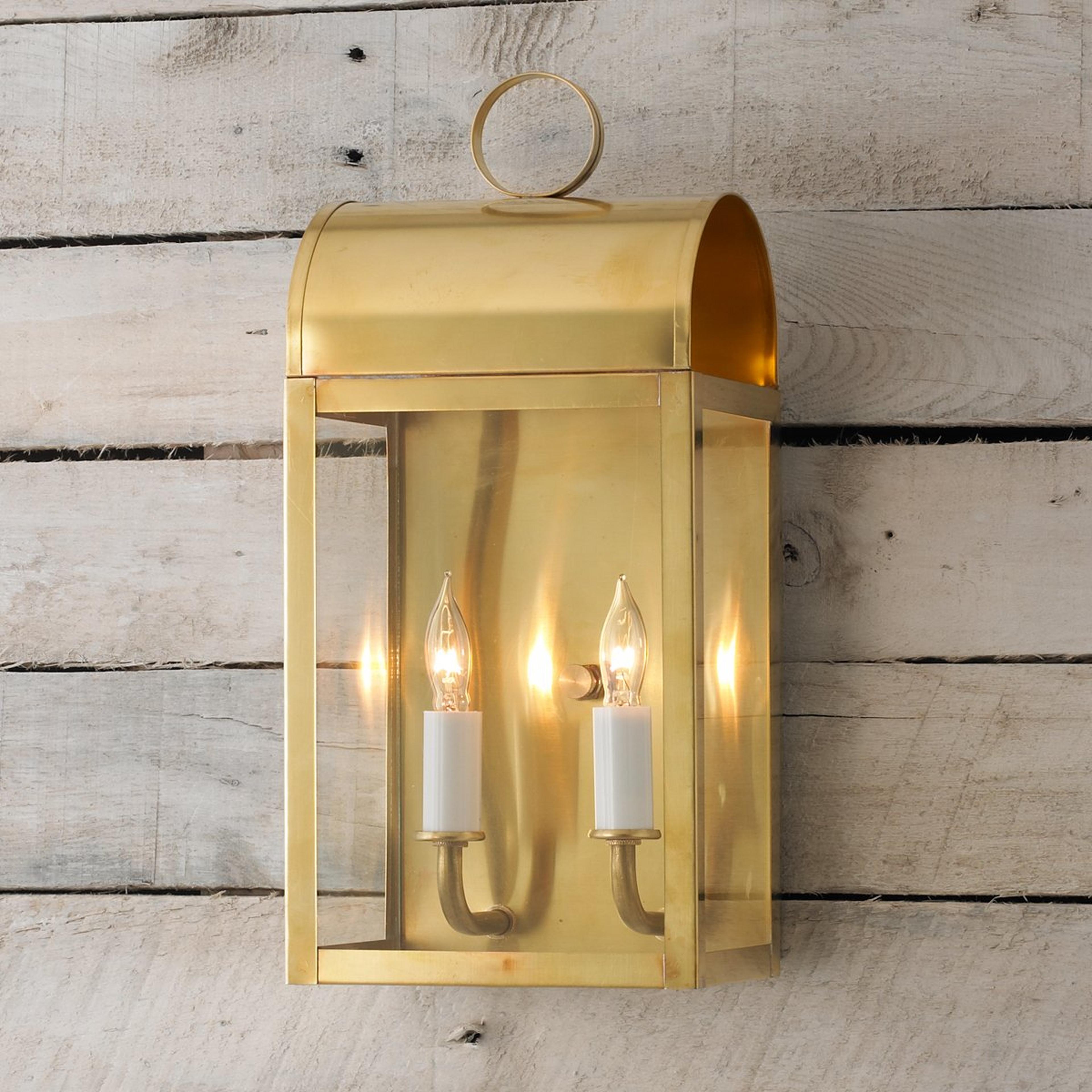 A Colonial Metalcrafts Arched Outdoor Sconce - Large with Brushed Brass / Clear Glass color