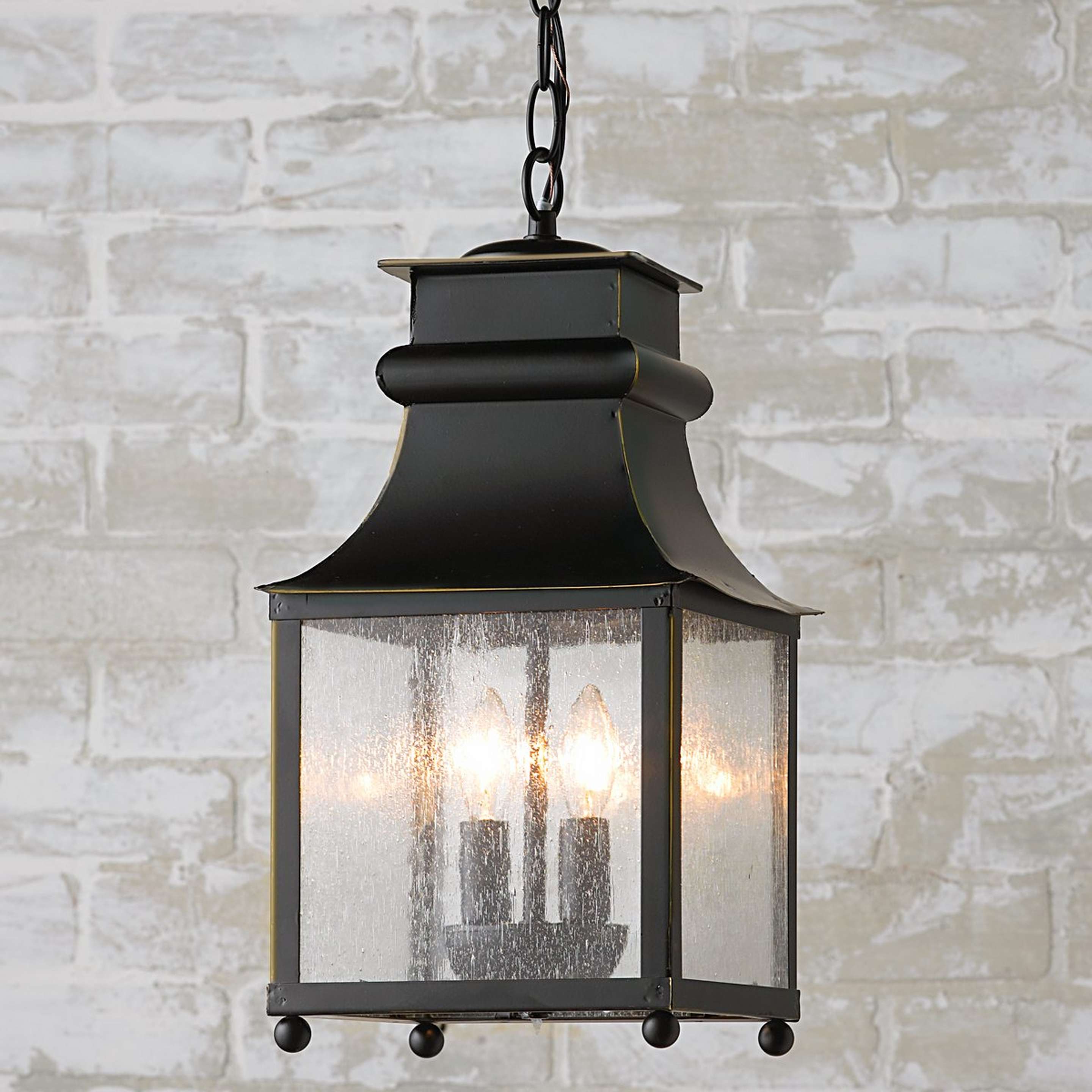 A Homesteader Seeded Glass Outdoor Lantern with Bronze color