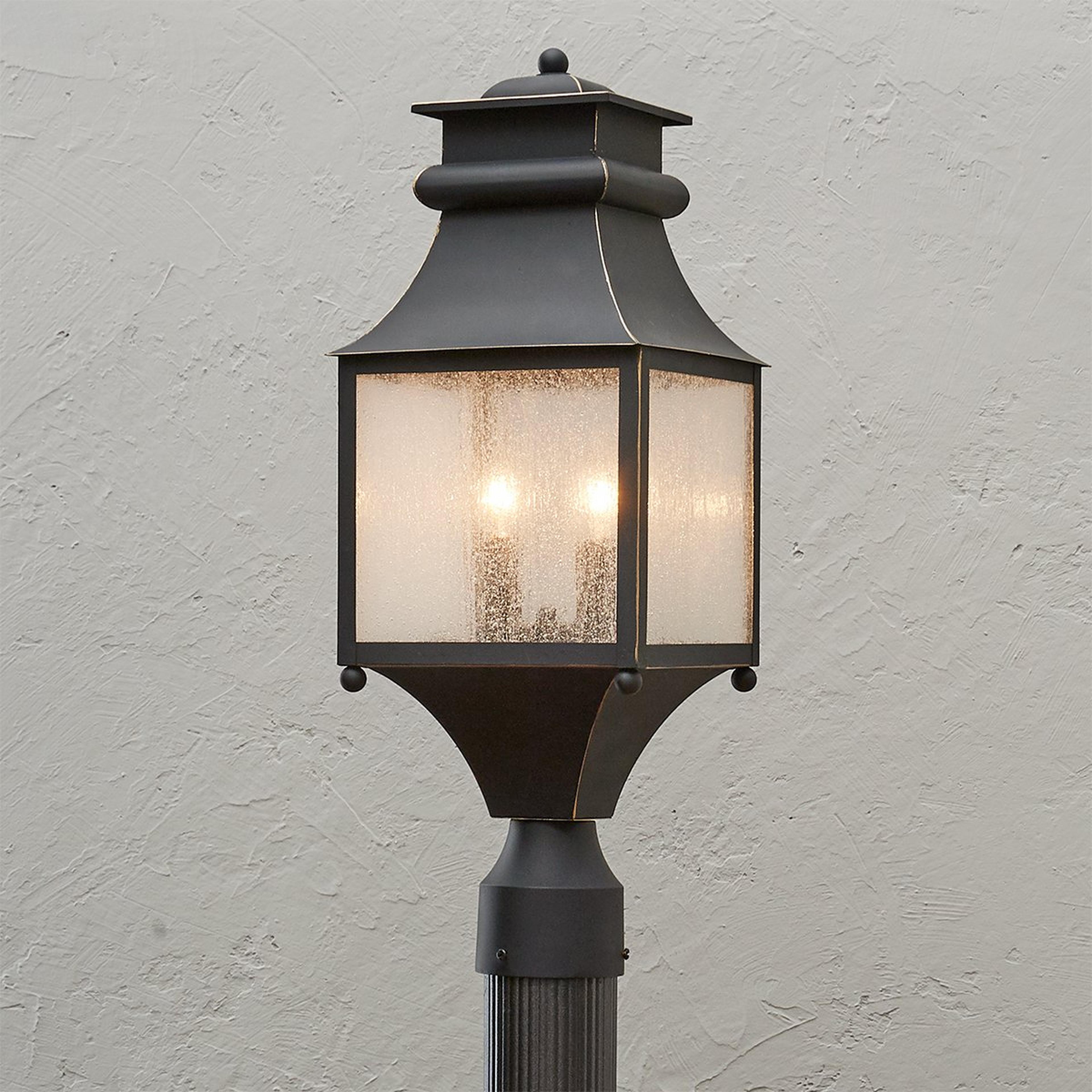 A Homesteader Seeded Glass Outdoor Post Light with Bronze color