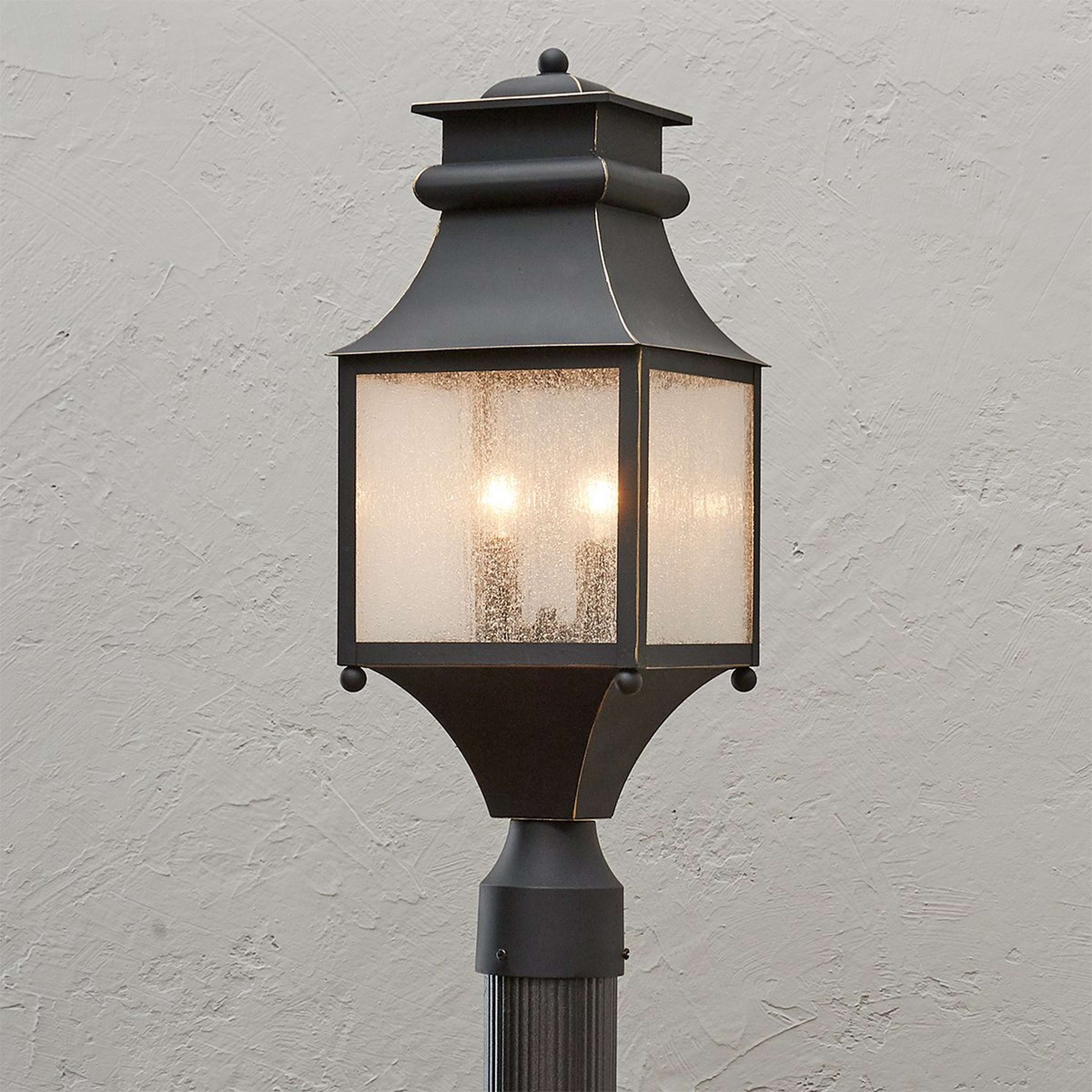A Homesteader Seeded Glass Outdoor Post Light with Bronze color