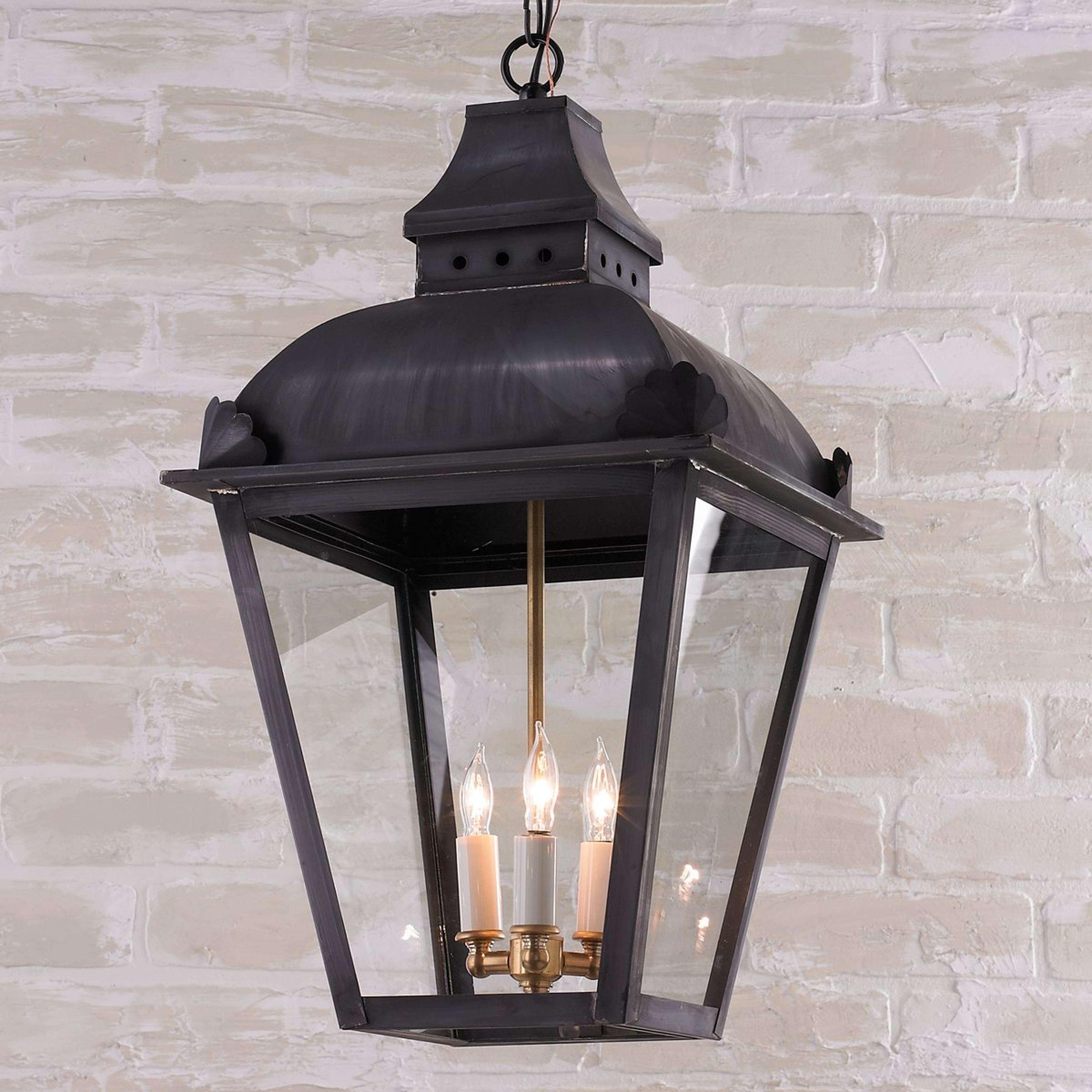 A Colonial Era Outdoor Lantern with Darkened Copper / Clear Glass  color