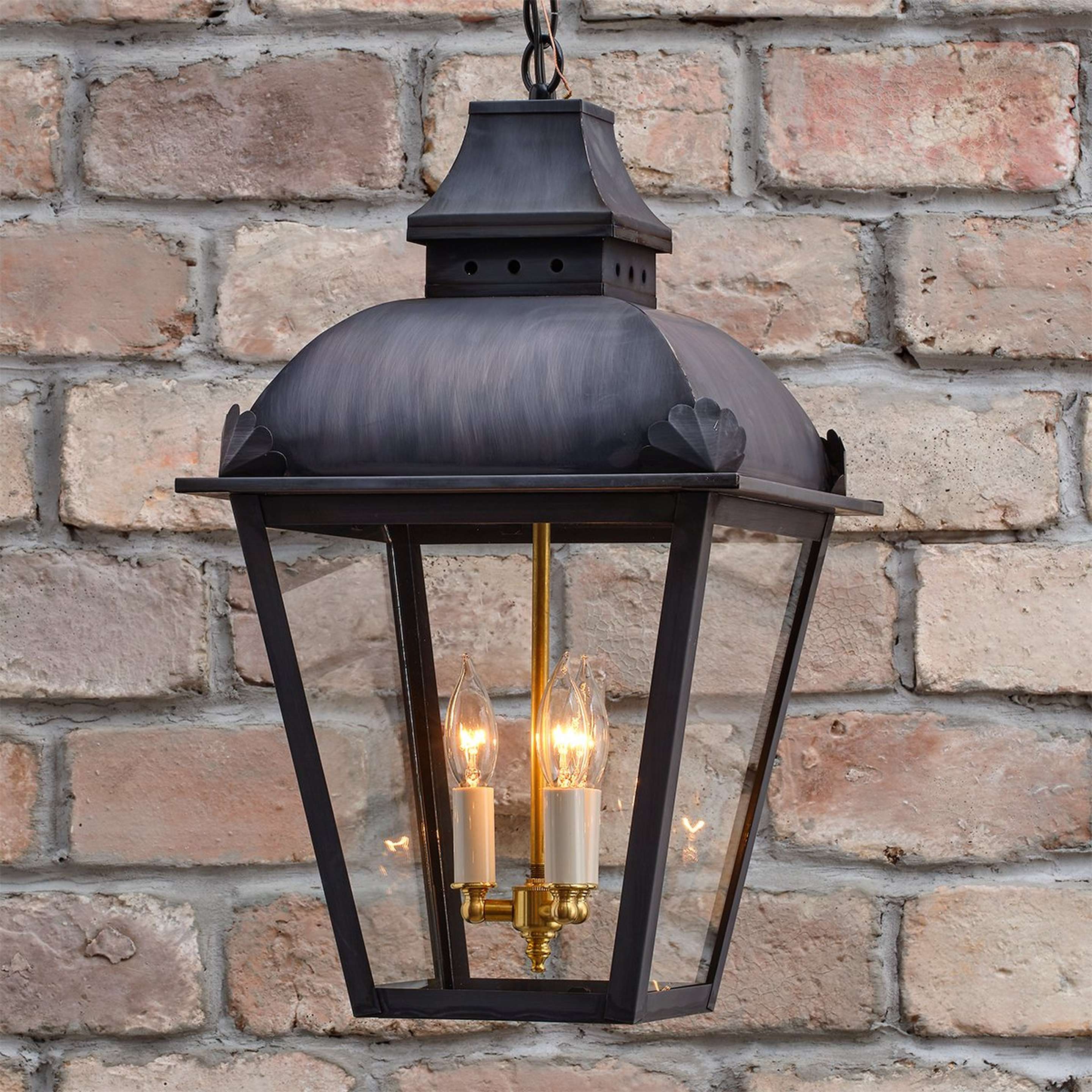 A Colonial Metalcrafts Regency Outdoor Lantern with Darkened Copper / Clear Glass color