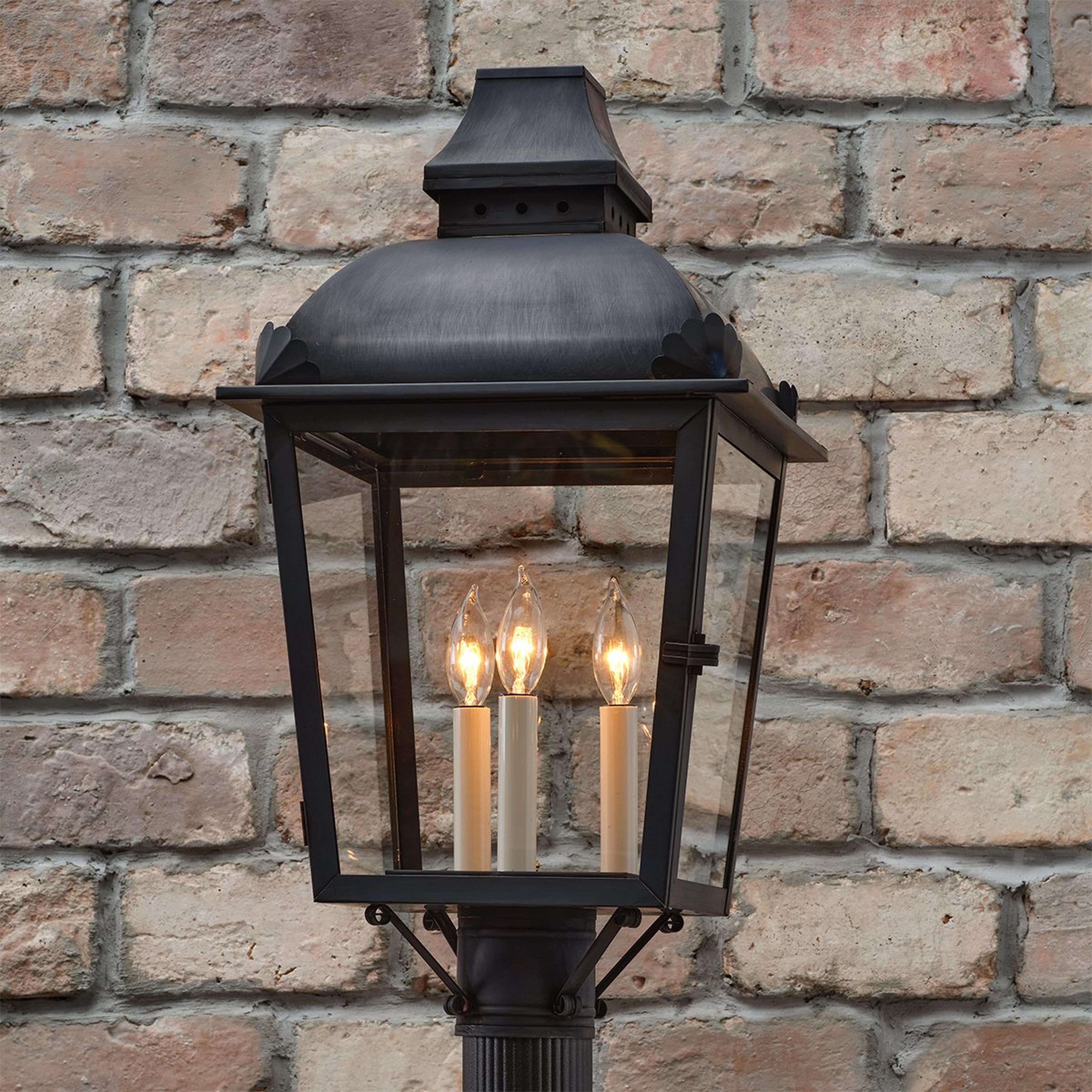 A Colonial Era Outdoor Post Light with Darkened Copper / Clear Glass color