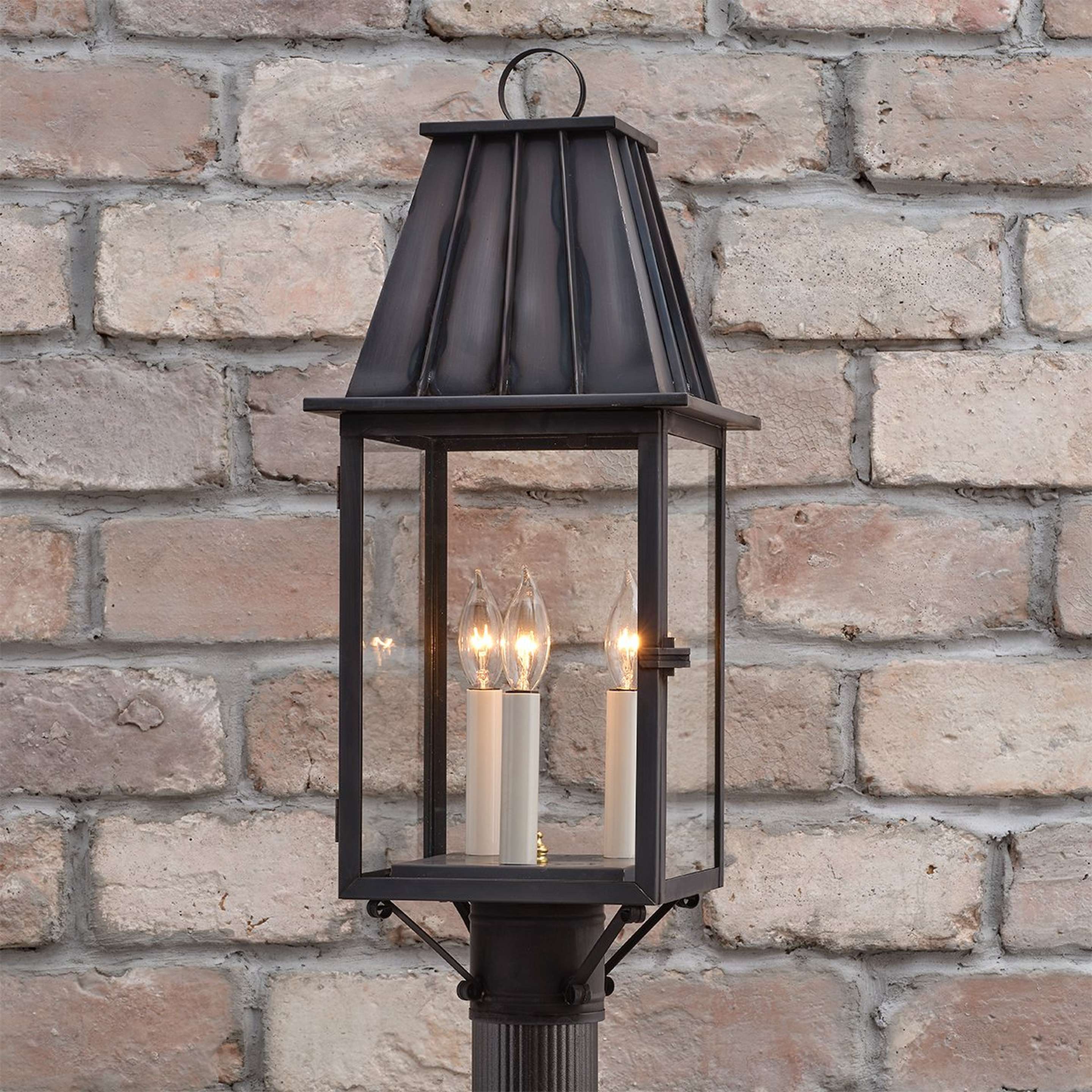 A Colonial Metalcrafts Mansard Outdoor Post Light with Darkened Copper / Clear Glass color