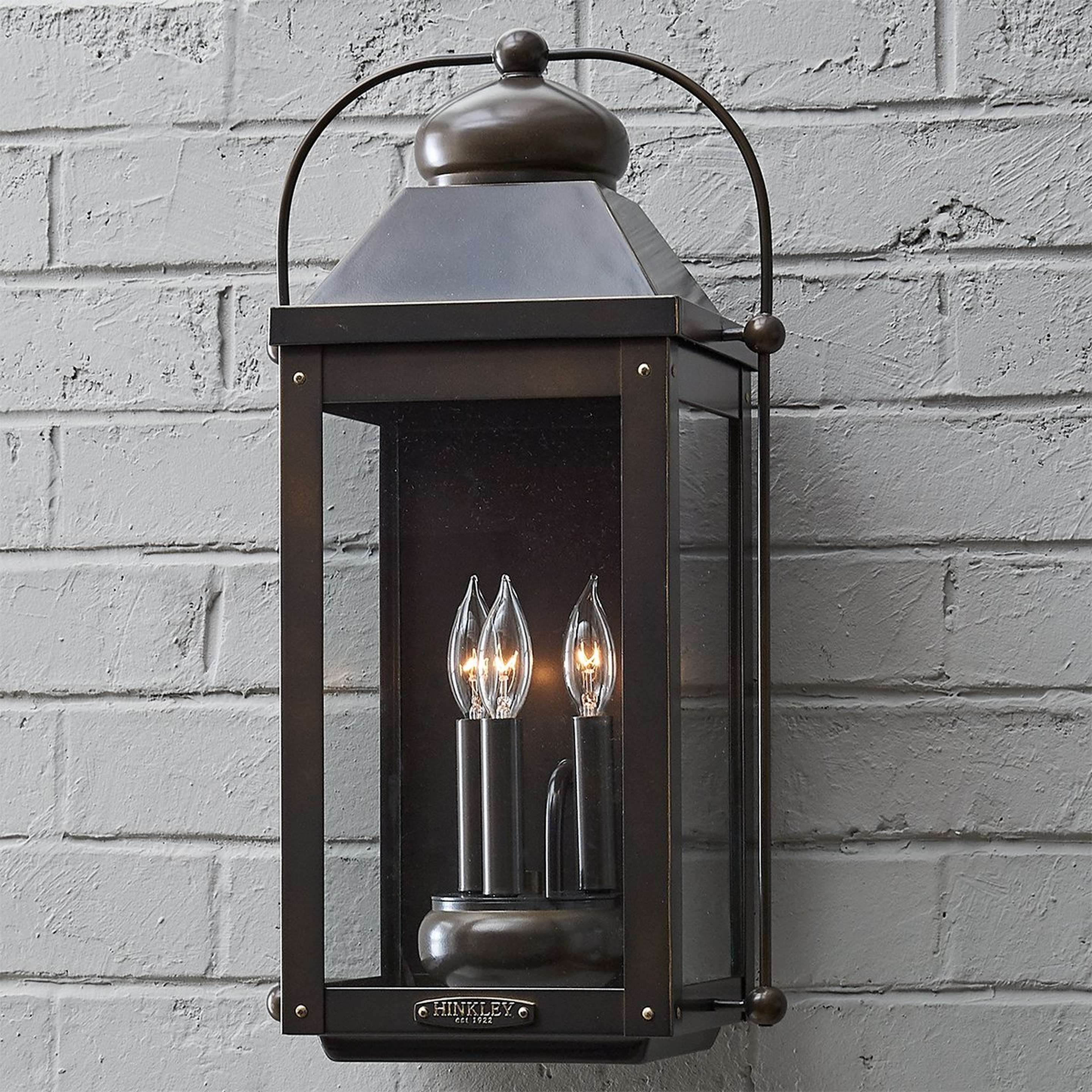 A Nostalgic Arched Carriage Outdoor Sconce - Medium with Light Oiled Bronze color