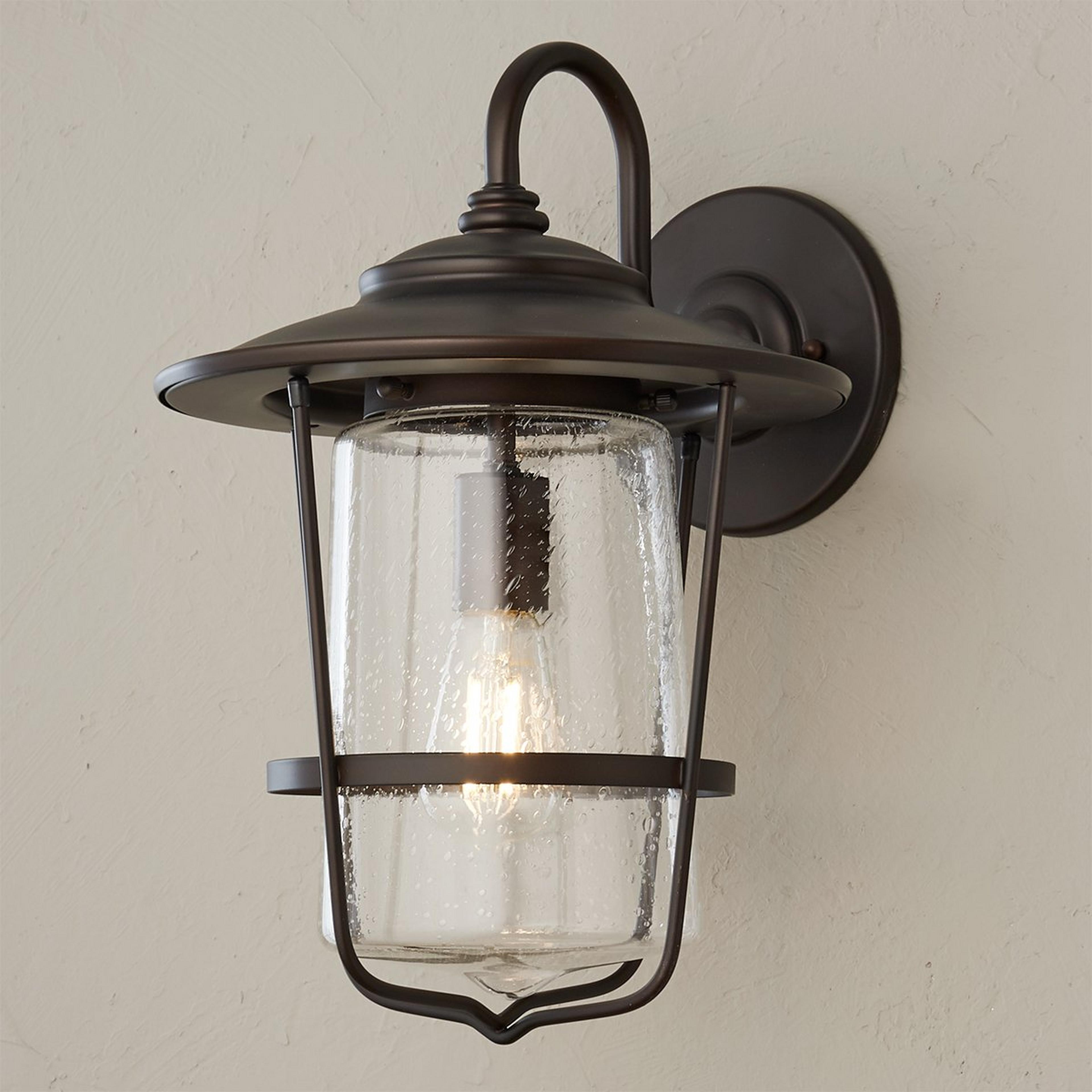 A Contemporary Seeded Glass  Outdoor Sconce - Medium with Old Bronze color