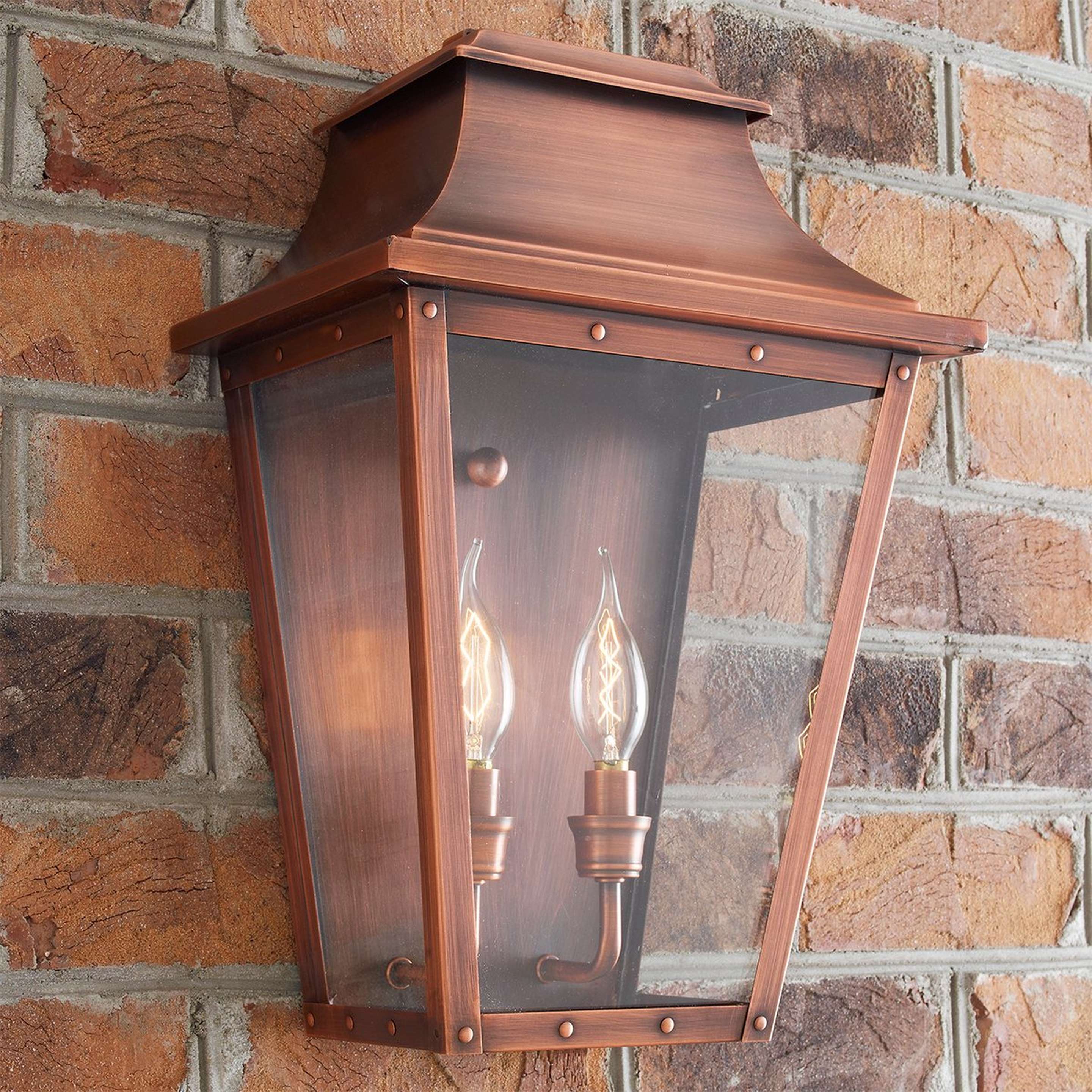 A Traditional Studded Tapered Outdoor Sconce - Large with Copper Patina color