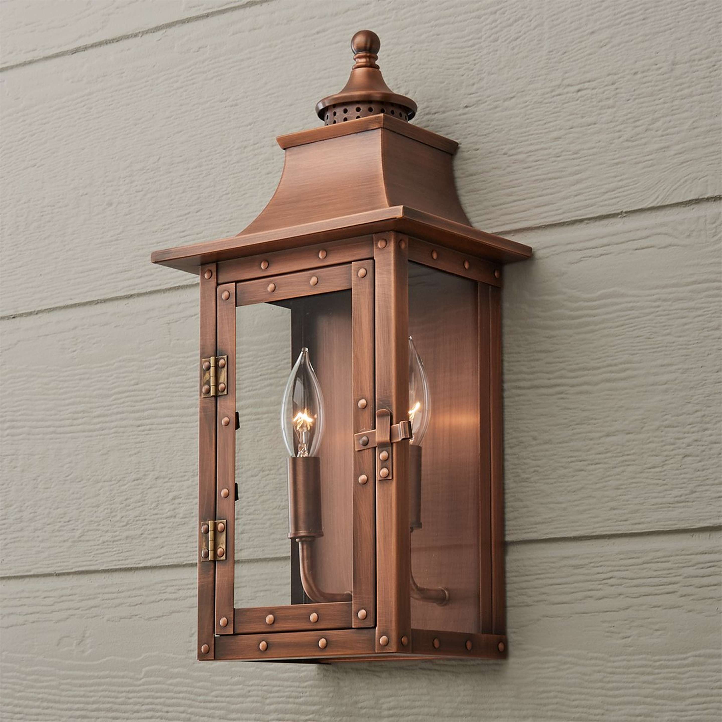 A Classic Vented Hood Outdoor Sconce - Small with Copper Patina color