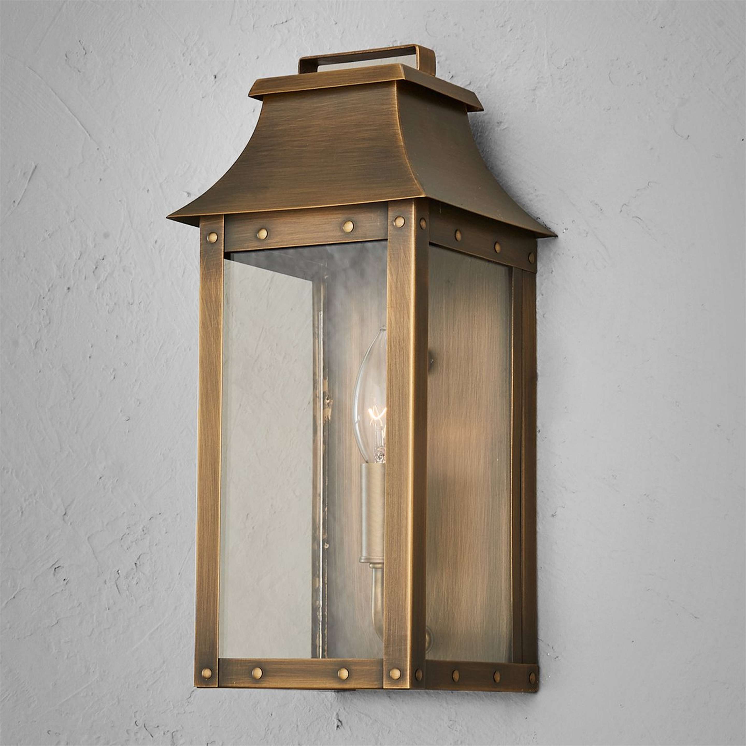 A Traditional Studded Framed Box Outdoor Sconce - Small with Aged Brass color