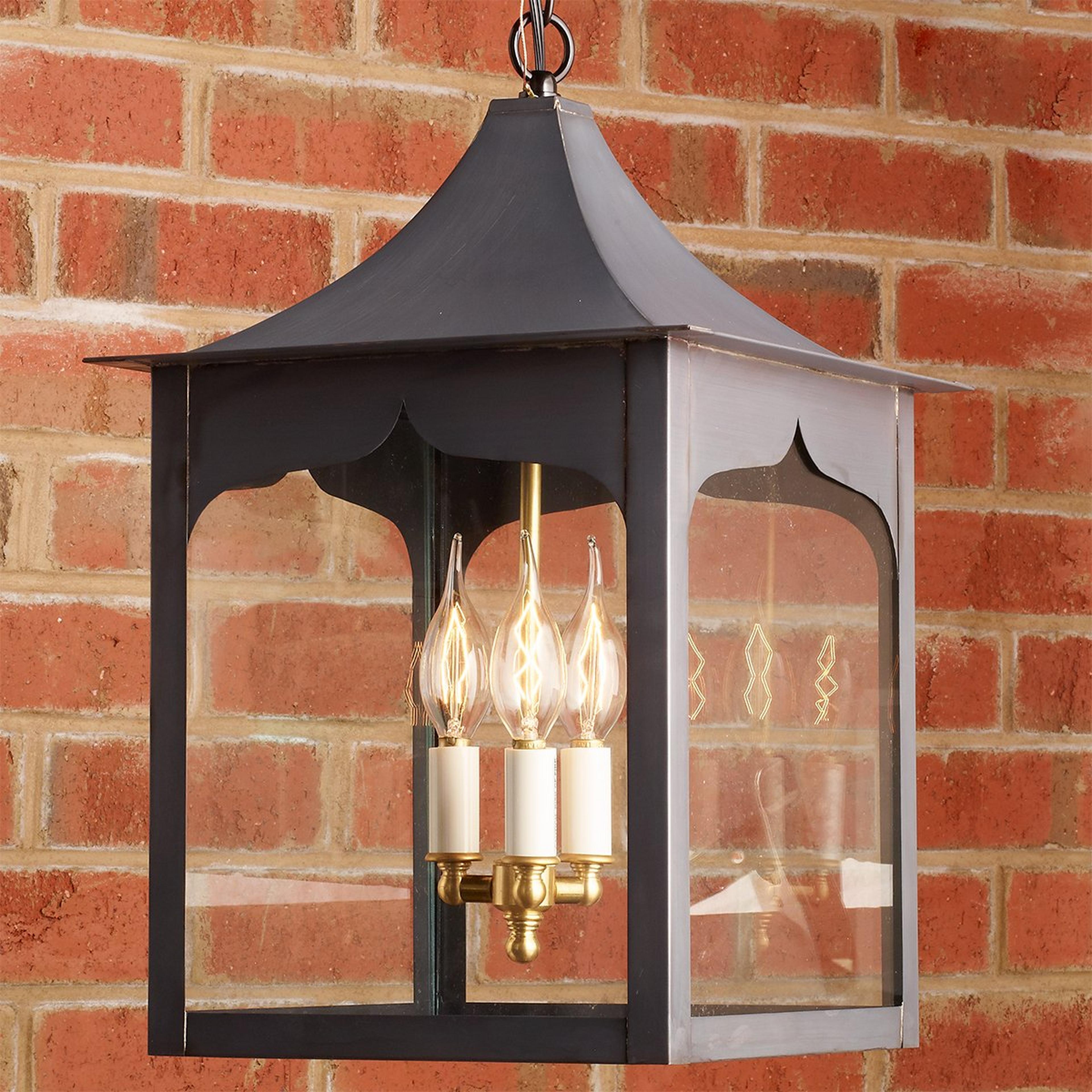 A Colonial Metalcrafts Meadow Outdoor Lantern with Darkened Copper / Clear Glass  color