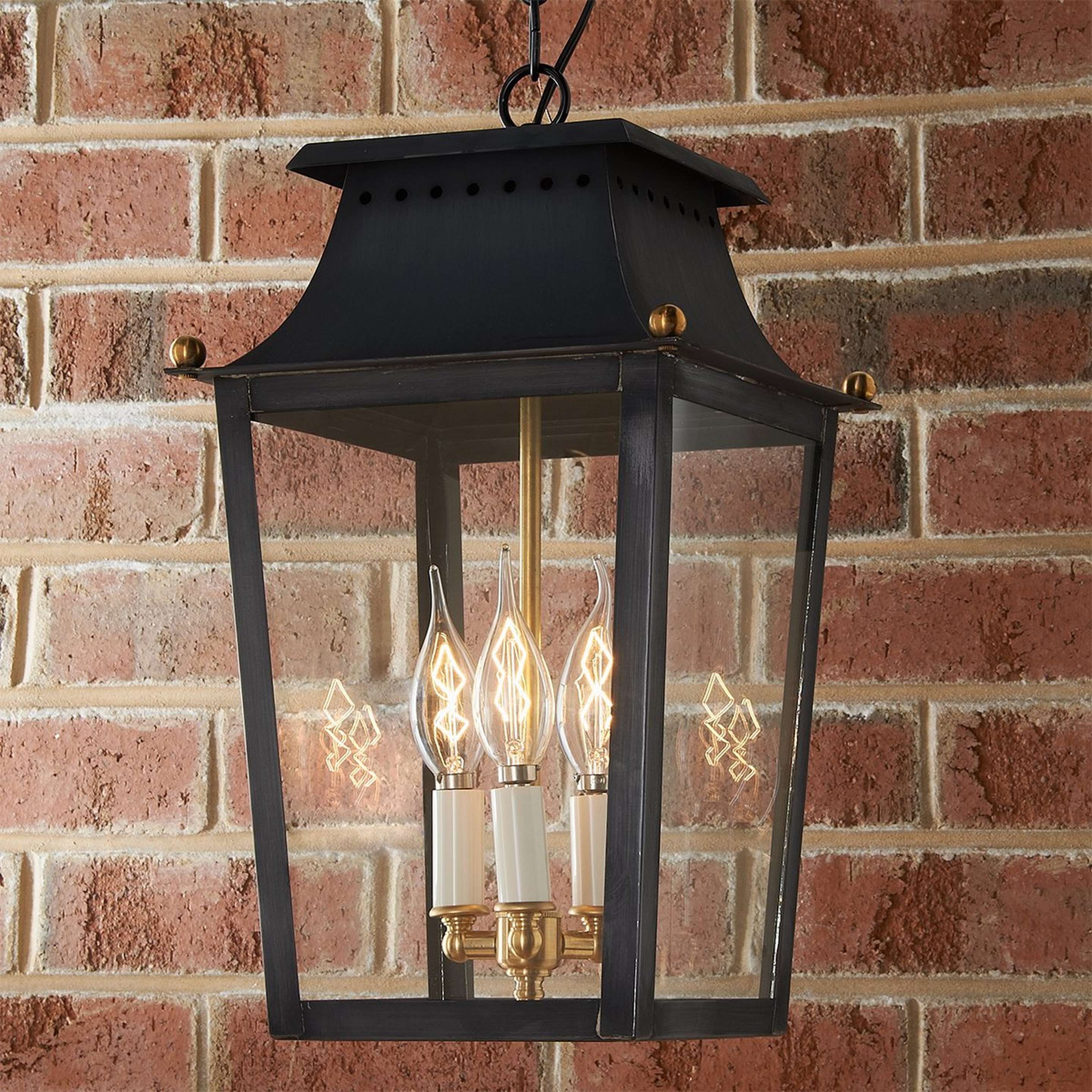A Colonial Metalcrafts Franklin Outdoor Lantern with Darkened Copper / Clear Glass color
