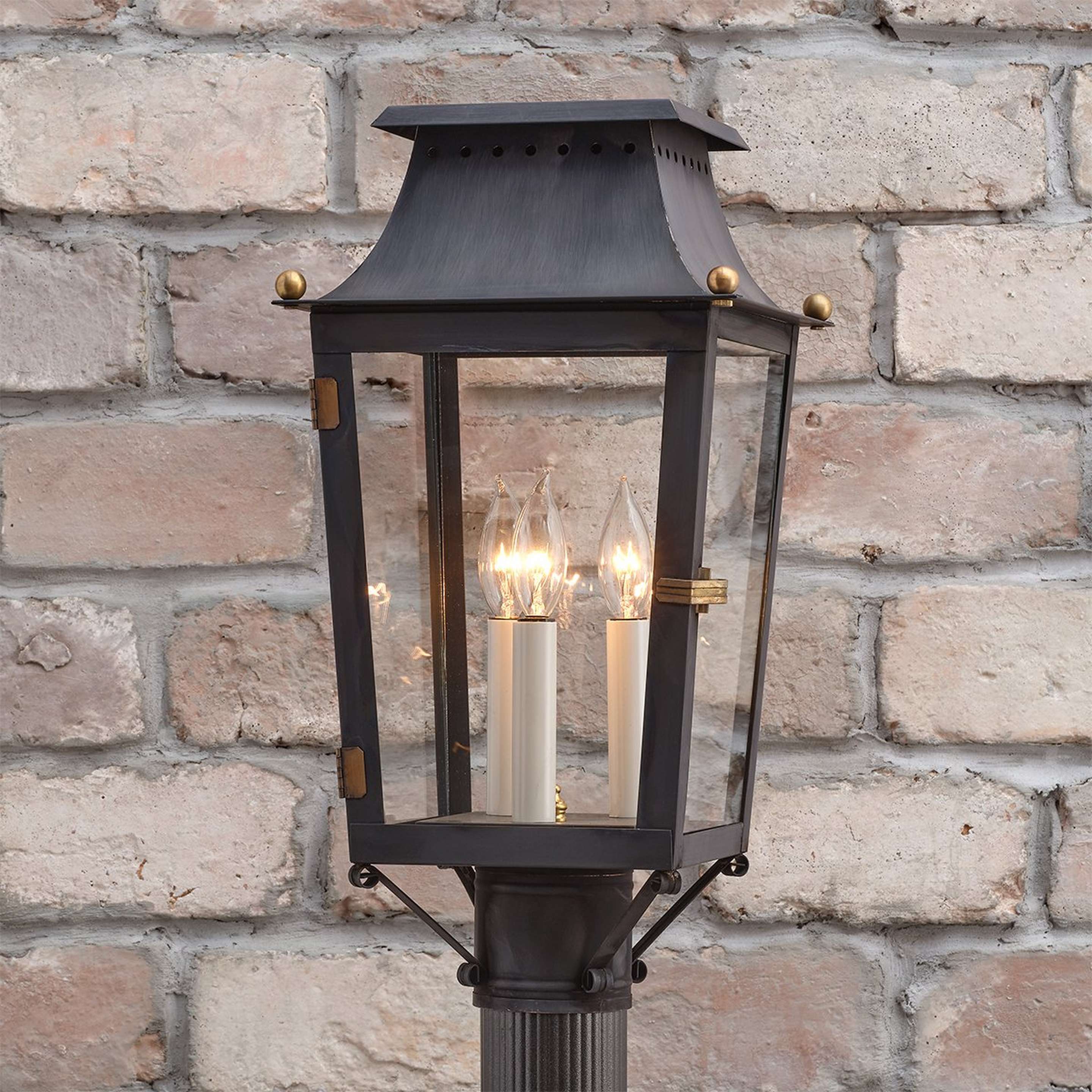 A Colonial Metalcrafts Franklin Outdoor Post Light with Darkened Copper / Clear Glass color