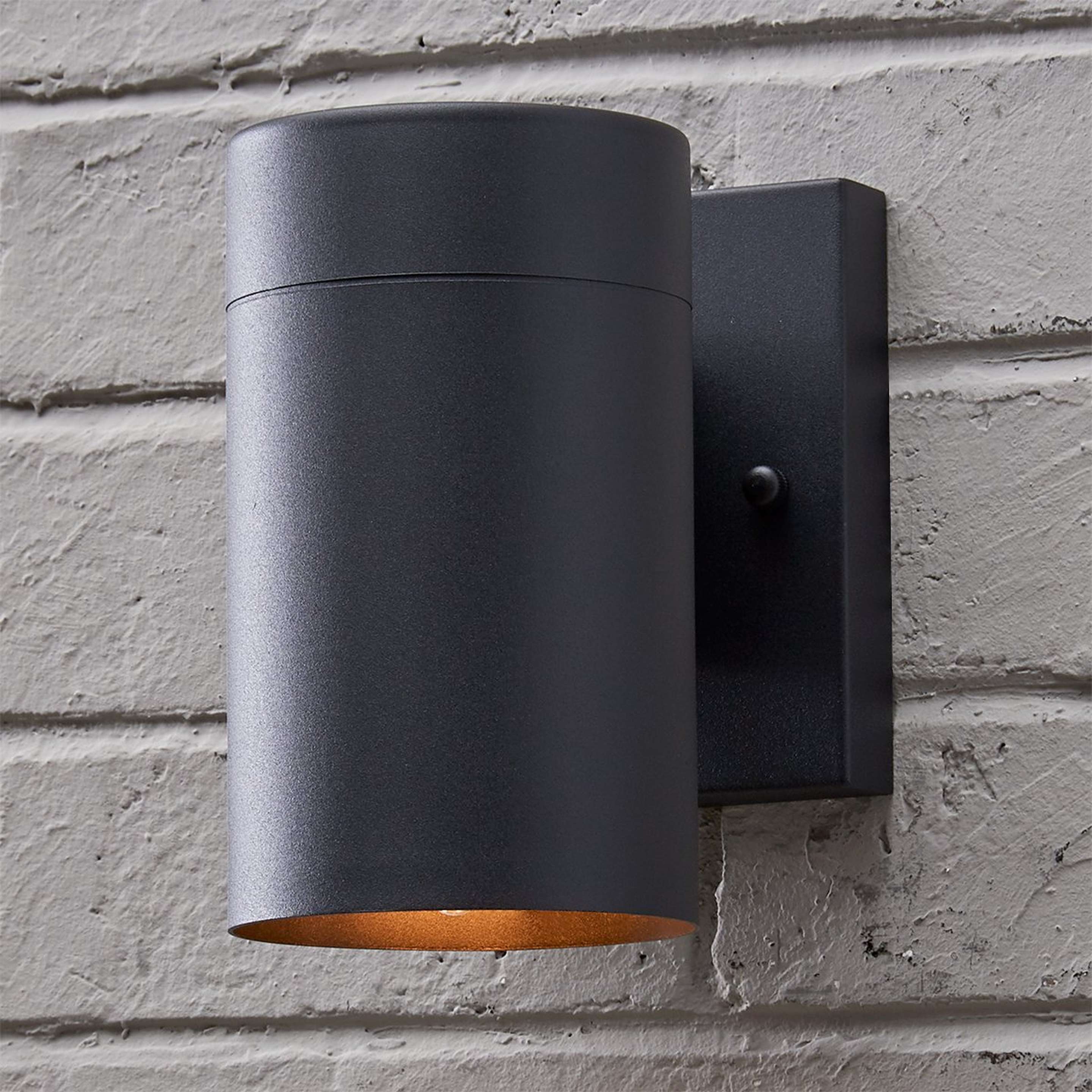 A Sleek Minimalist Outdoor Sconce with Matte Black color